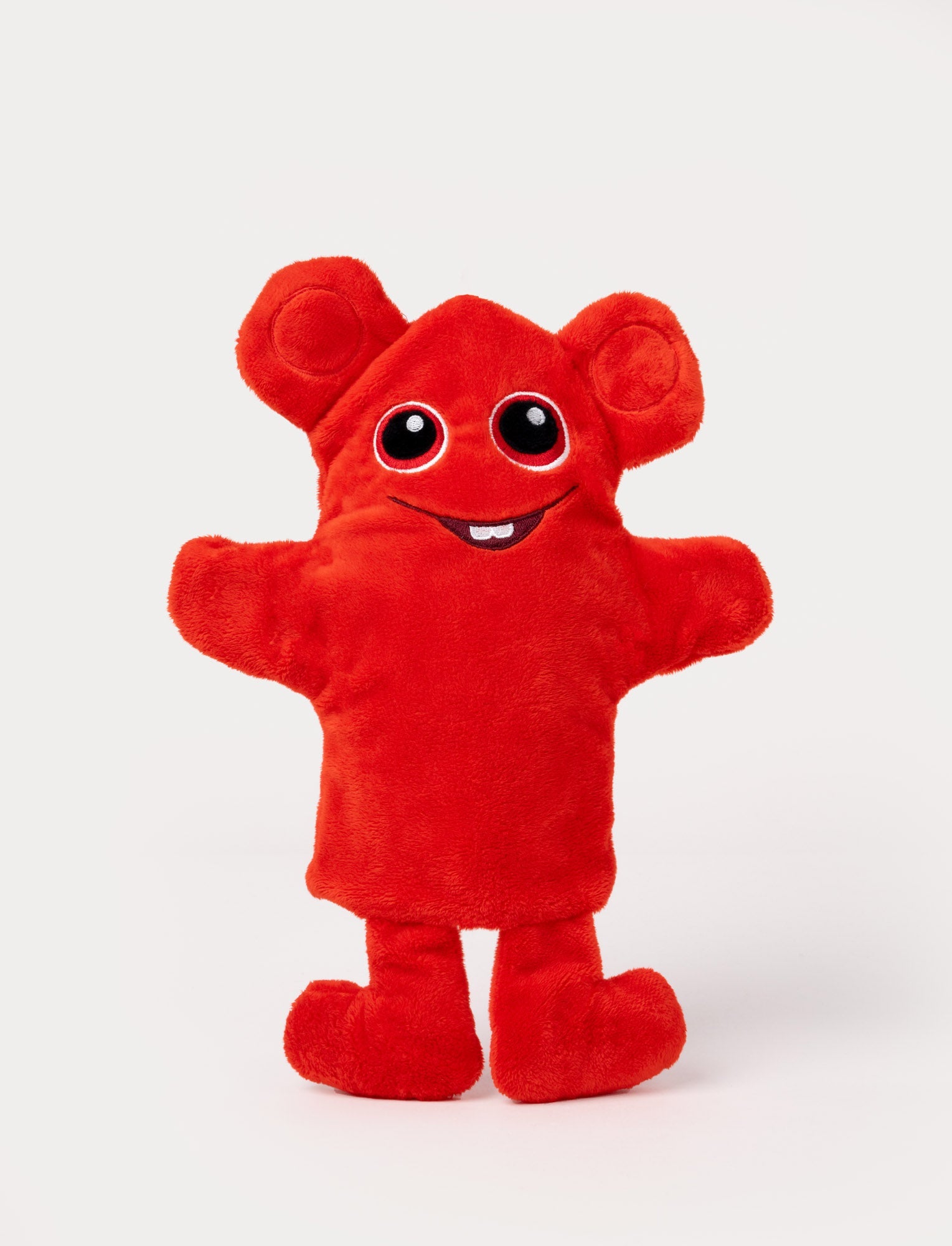 Image of Red hand puppet with large round ears, big eyes, outstretched arms, and a cheerful embroidered smile with a small tooth.
