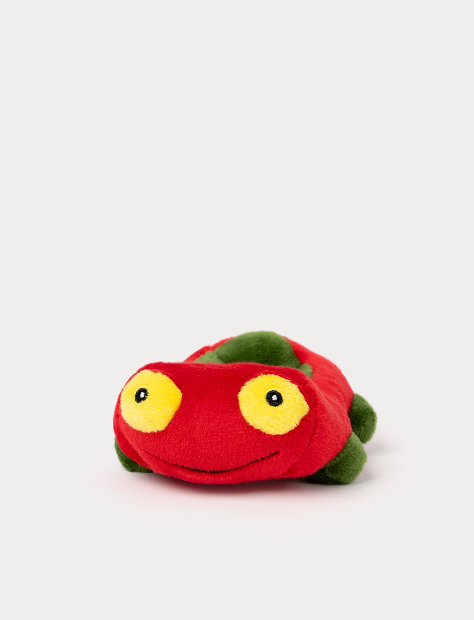 Image of Small, red, and soft plush car with a colorful design. Featuring a friendly and playful expression