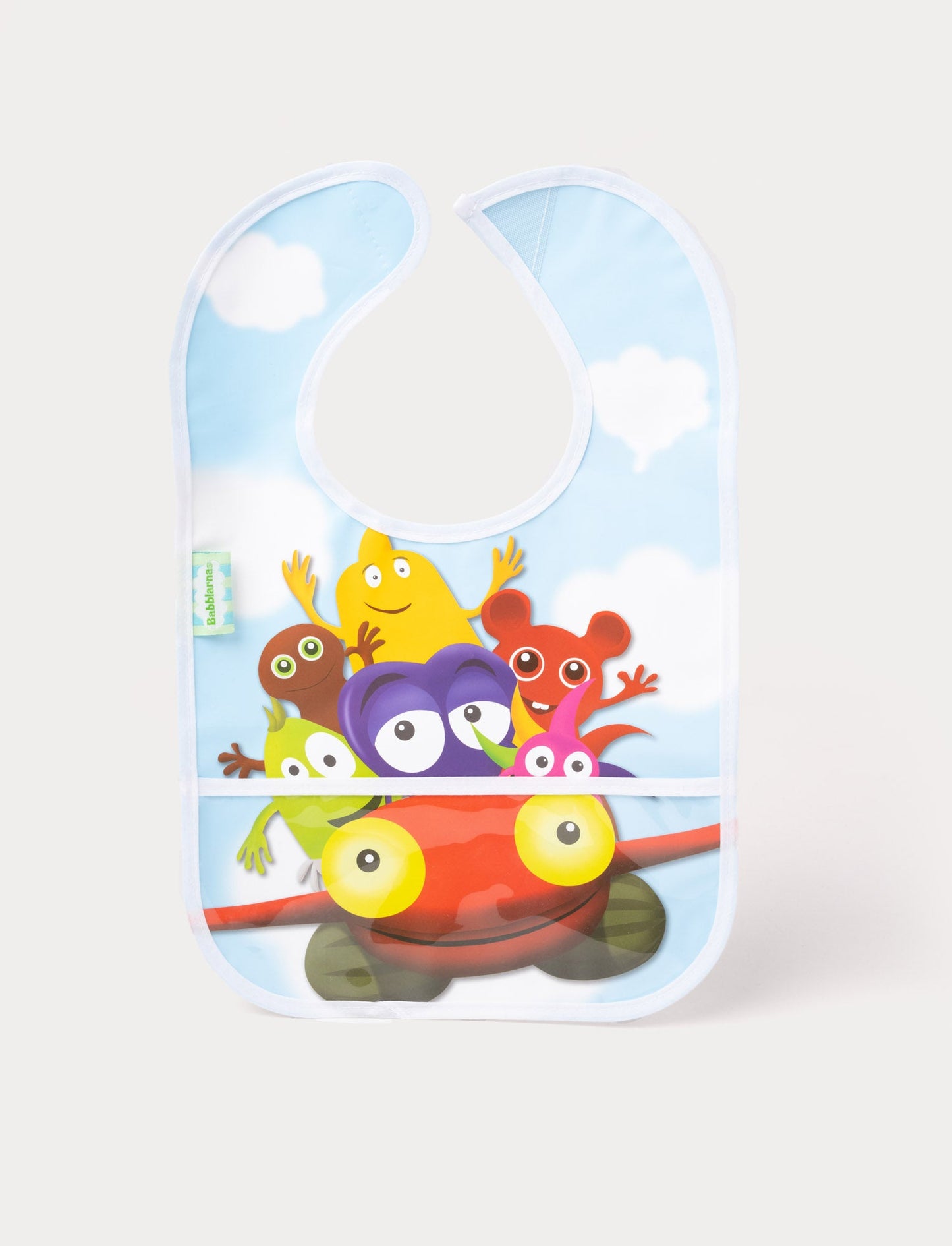 A baby bib featuring Babblarna characters riding a red car against a blue sky with clouds.
