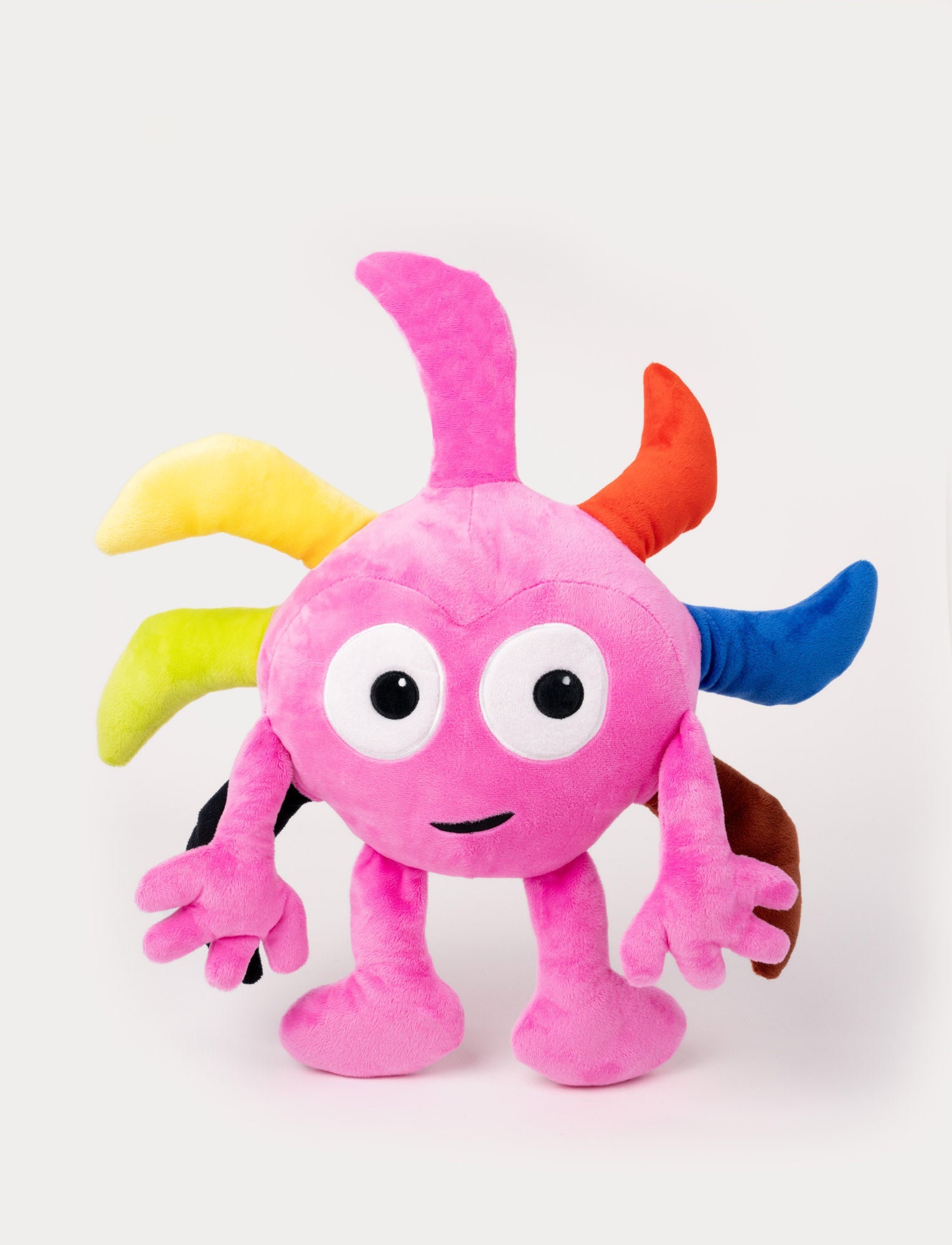 Image of Pink plush toy with large eyes, a cheerful smile and colorful spikes on its head.