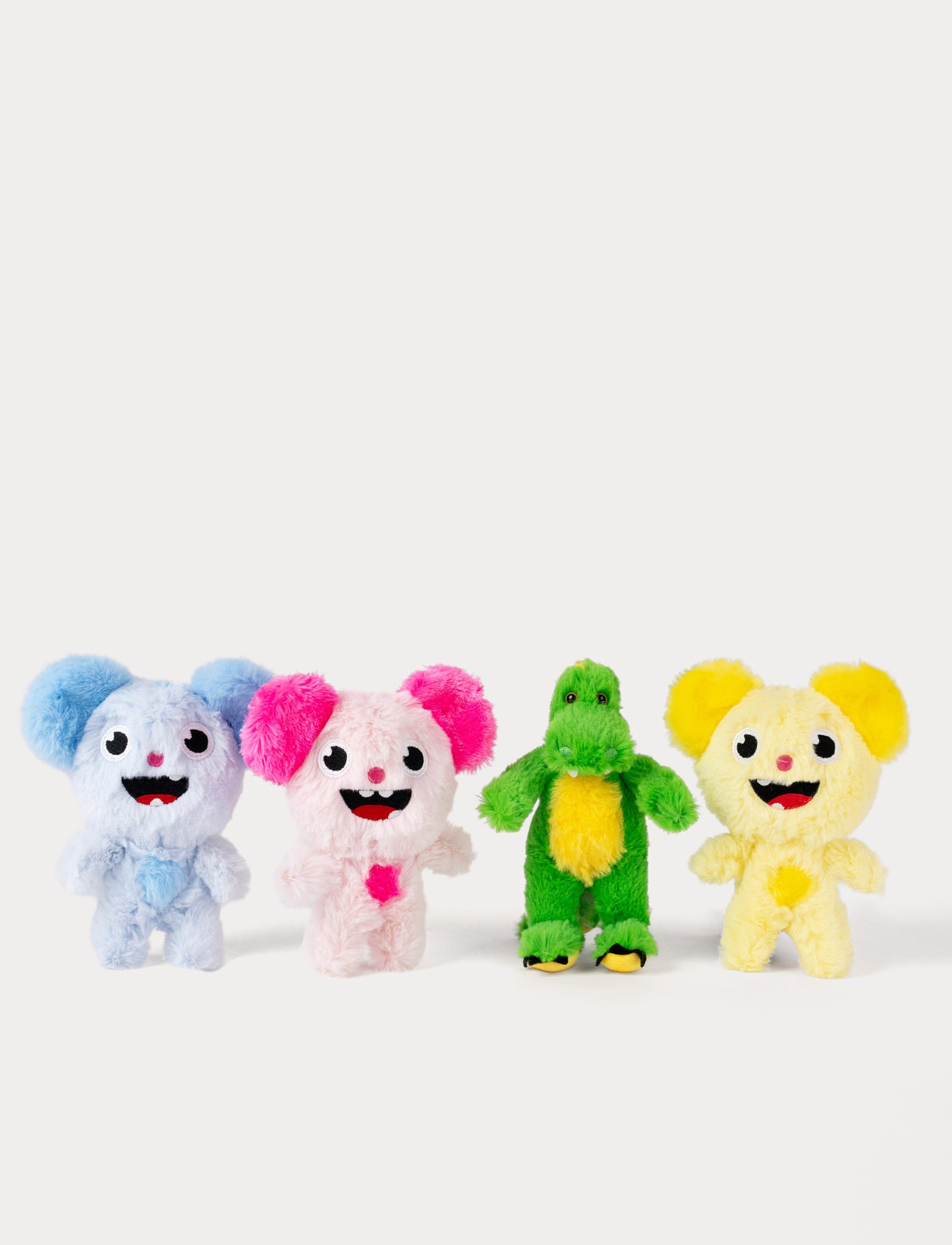 Four colorful Bolibompa plush toys on a white background. Dragon and Filmisar
