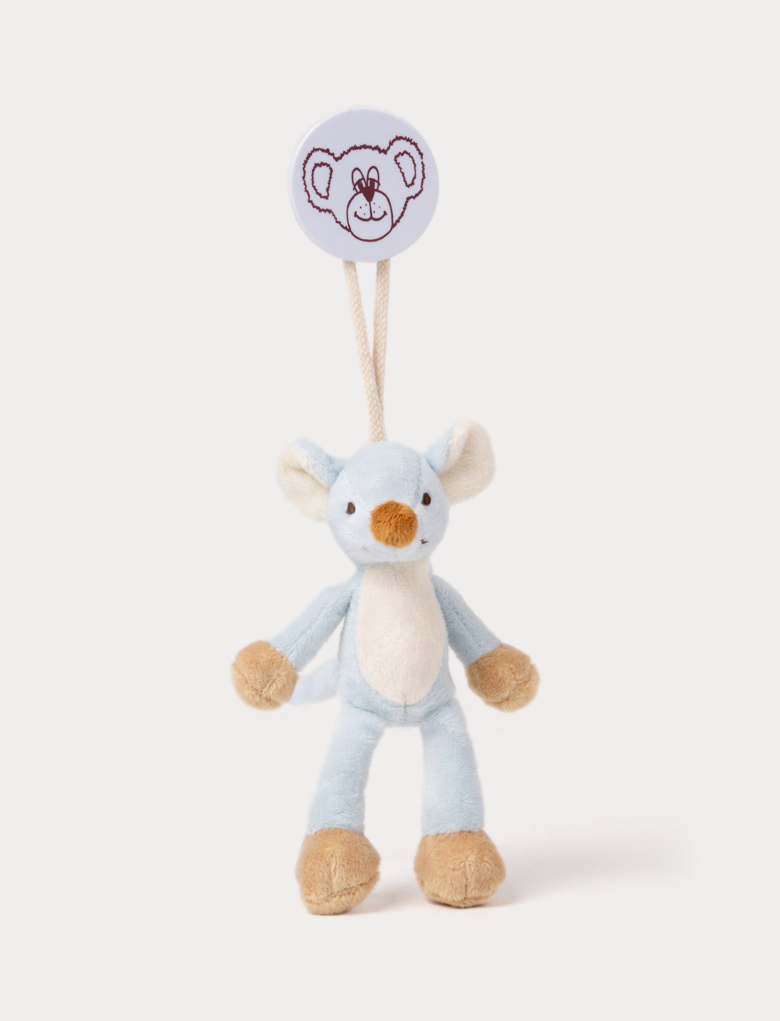 Image of Soft blue plush mouse with beige paws, feet, and nose, hanging from a clip with a bear face illustration.
