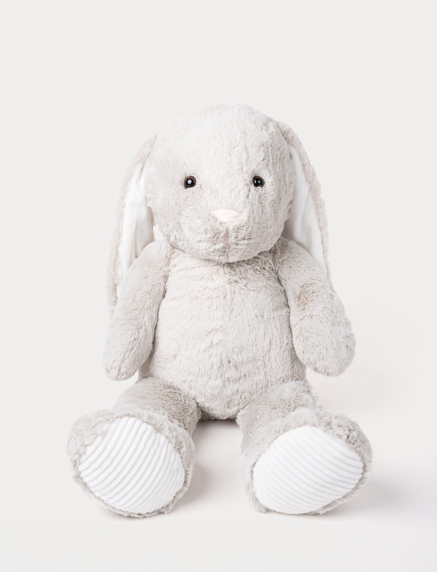 Image of Soft grey plush bunny with long floppy ears, a pink nose, and ribbed white fabric on its paws.