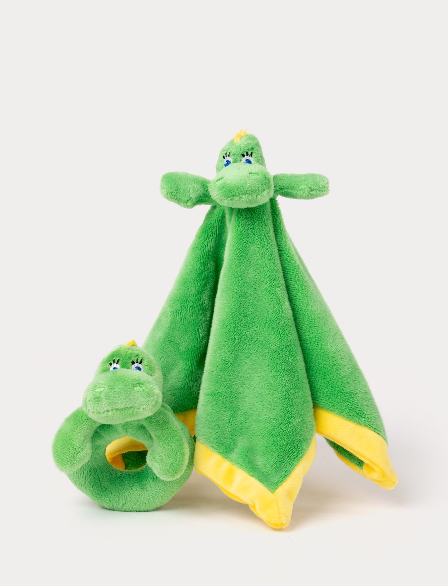 Set of two green Bolibompa dragon plush toys, including a rattle and a comfort blanket with a dragon head.