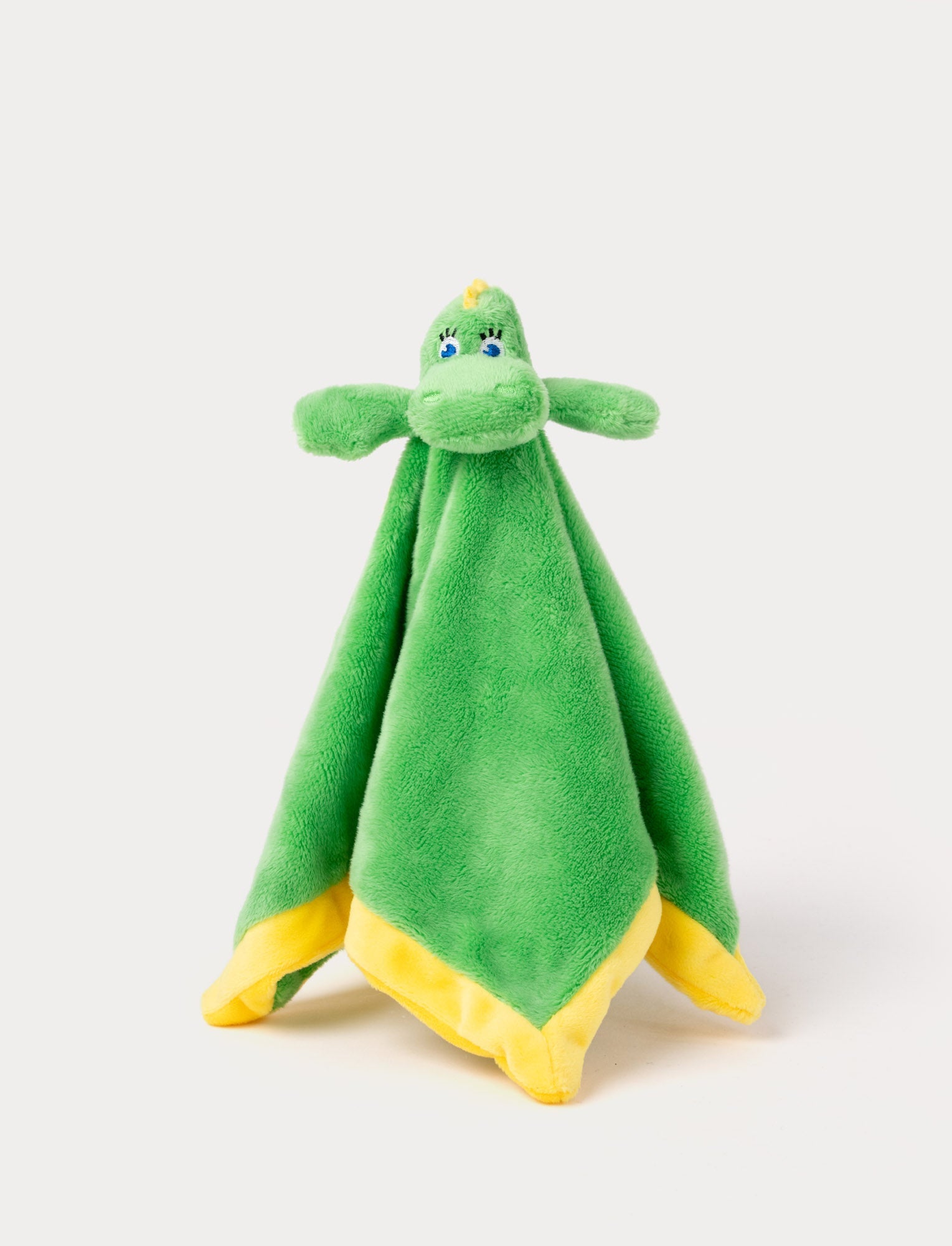 Image of A soft green comfort blanket featuring the Bolibompa dragon with yellow trim edges.