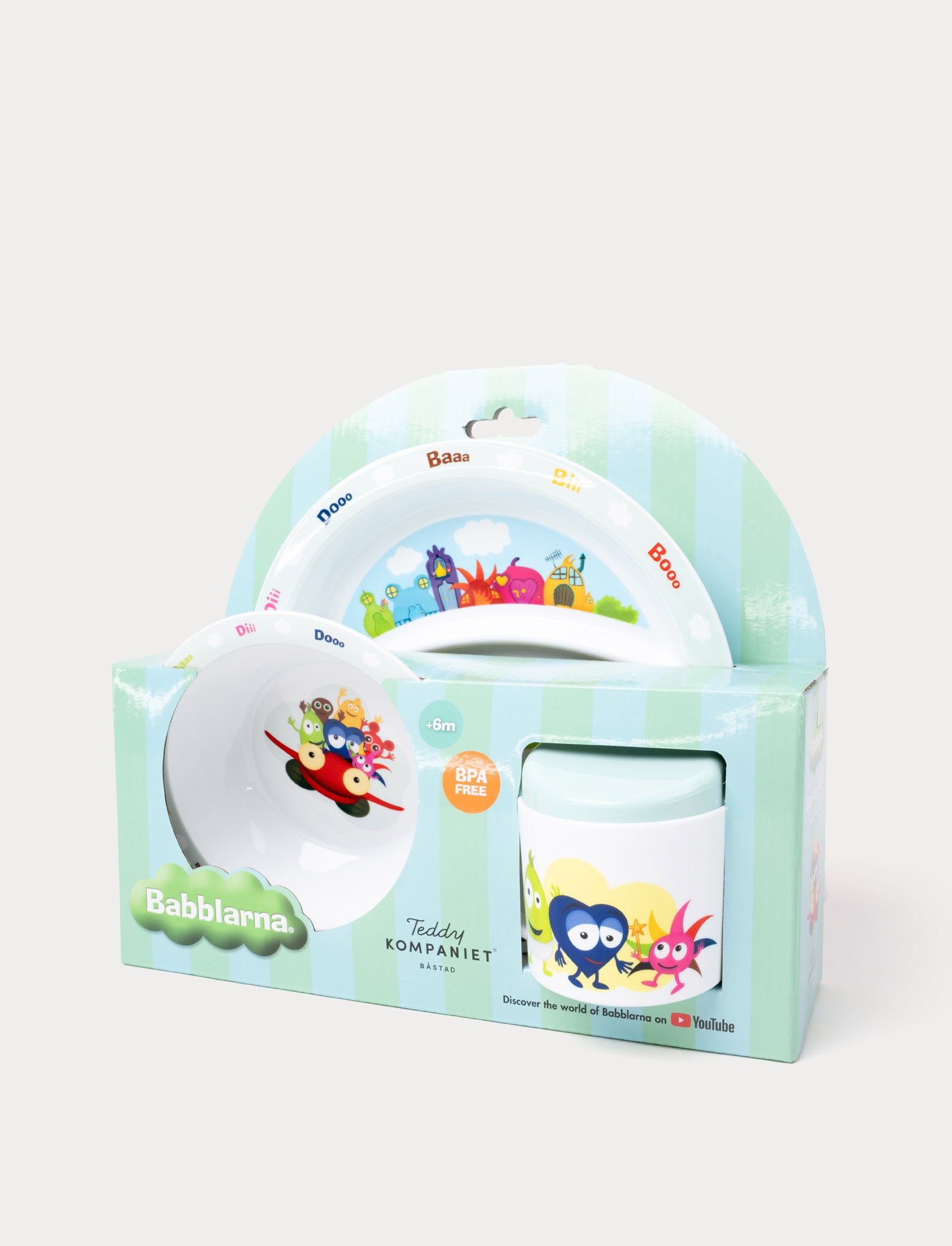 Image of A children's dining set featuring Babblarna characters, including a plate, bowl, and cup in green packaging.