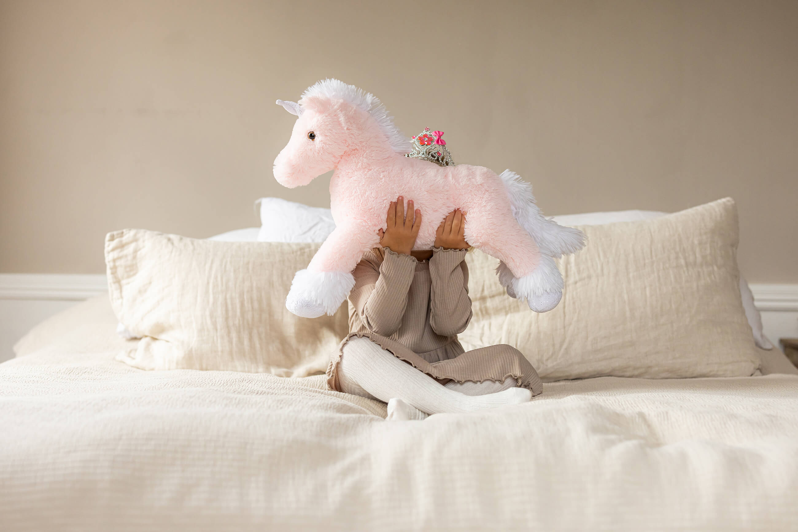 Image of files/13034_GirlBedHug_LOW.jpg