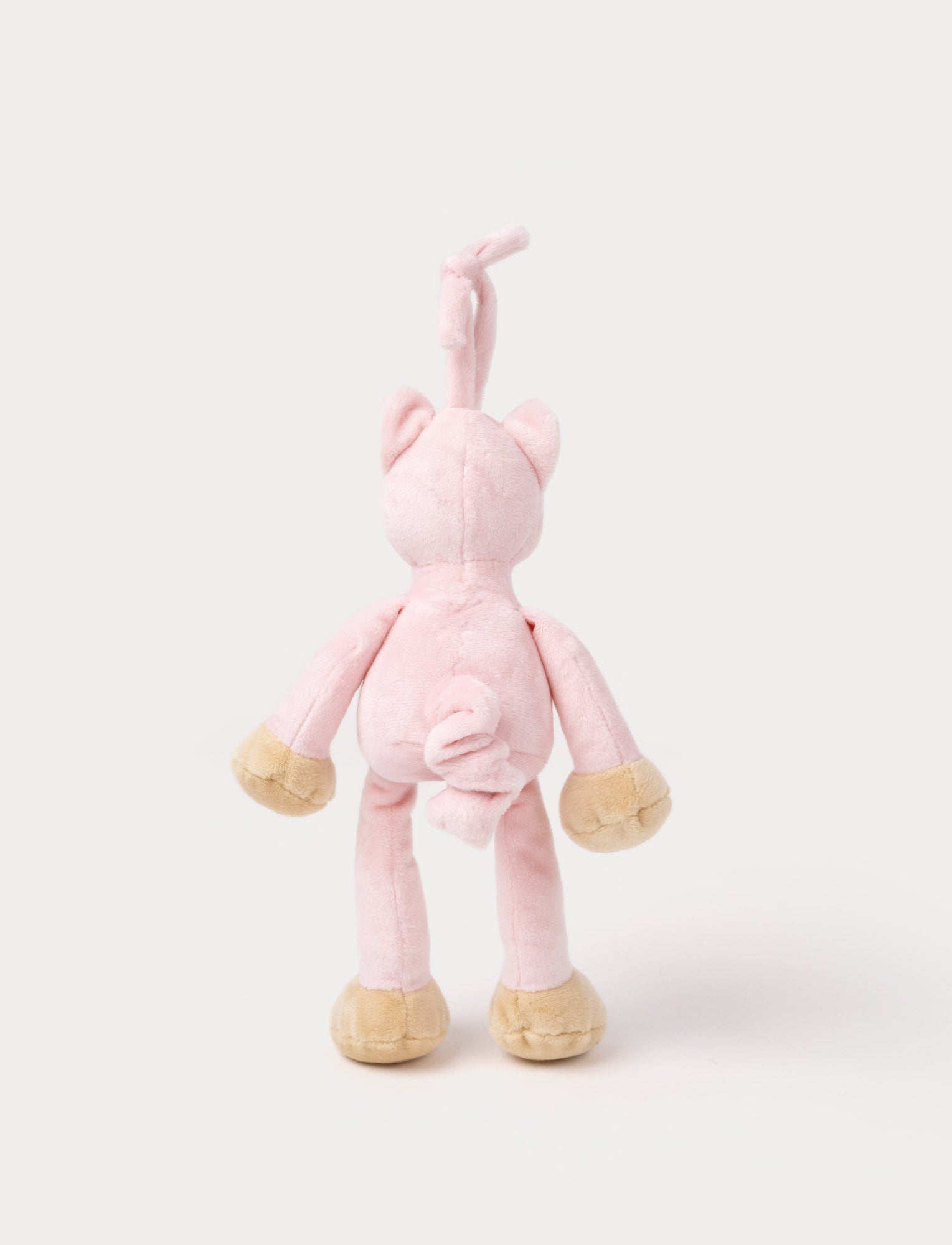 Image of A plush pink cat music box toy with a white belly, beige paws, a stitched smiling face, and a fabric loop on top for hanging