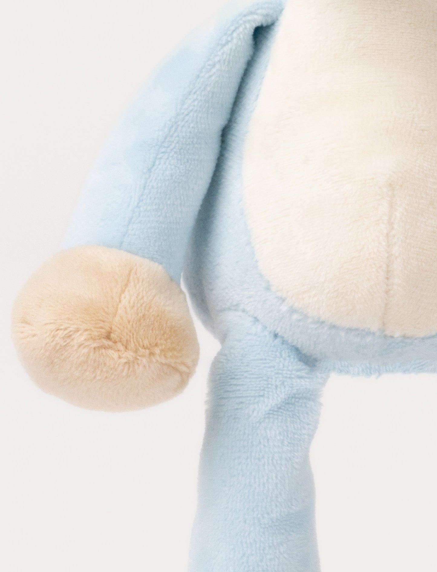 A plush blue mouse music box with large ears, a white belly, and a fabric loop for hanging.