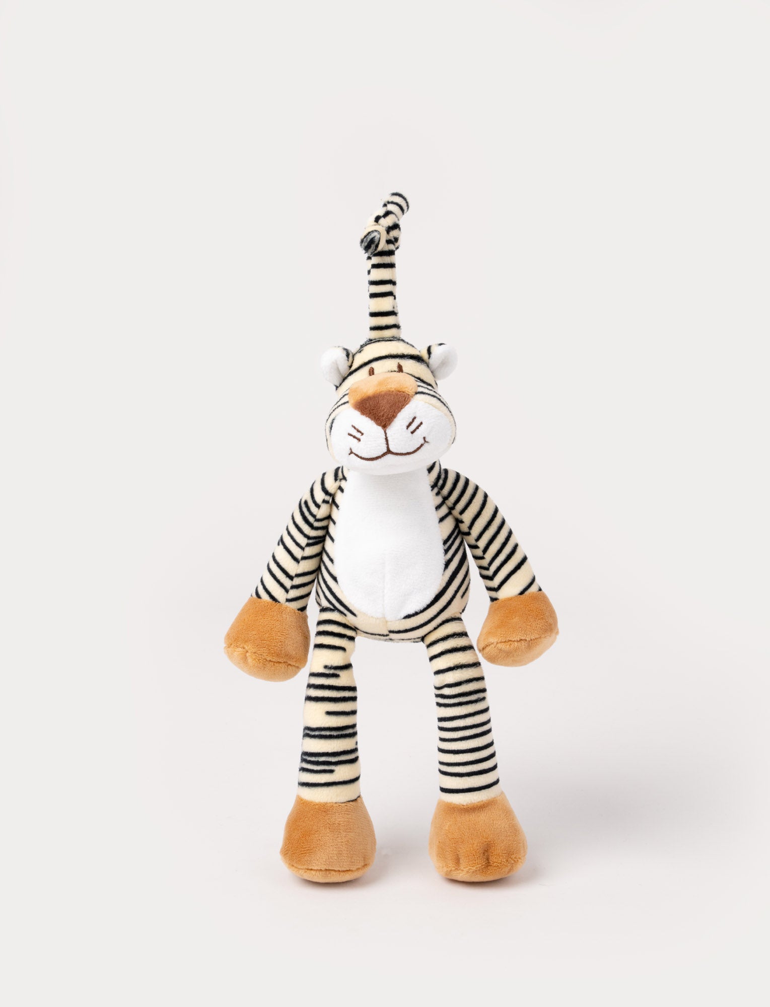 Image of A plush tiger music box with black stripes, a white belly, beige paws, and a fabric loop for hanging