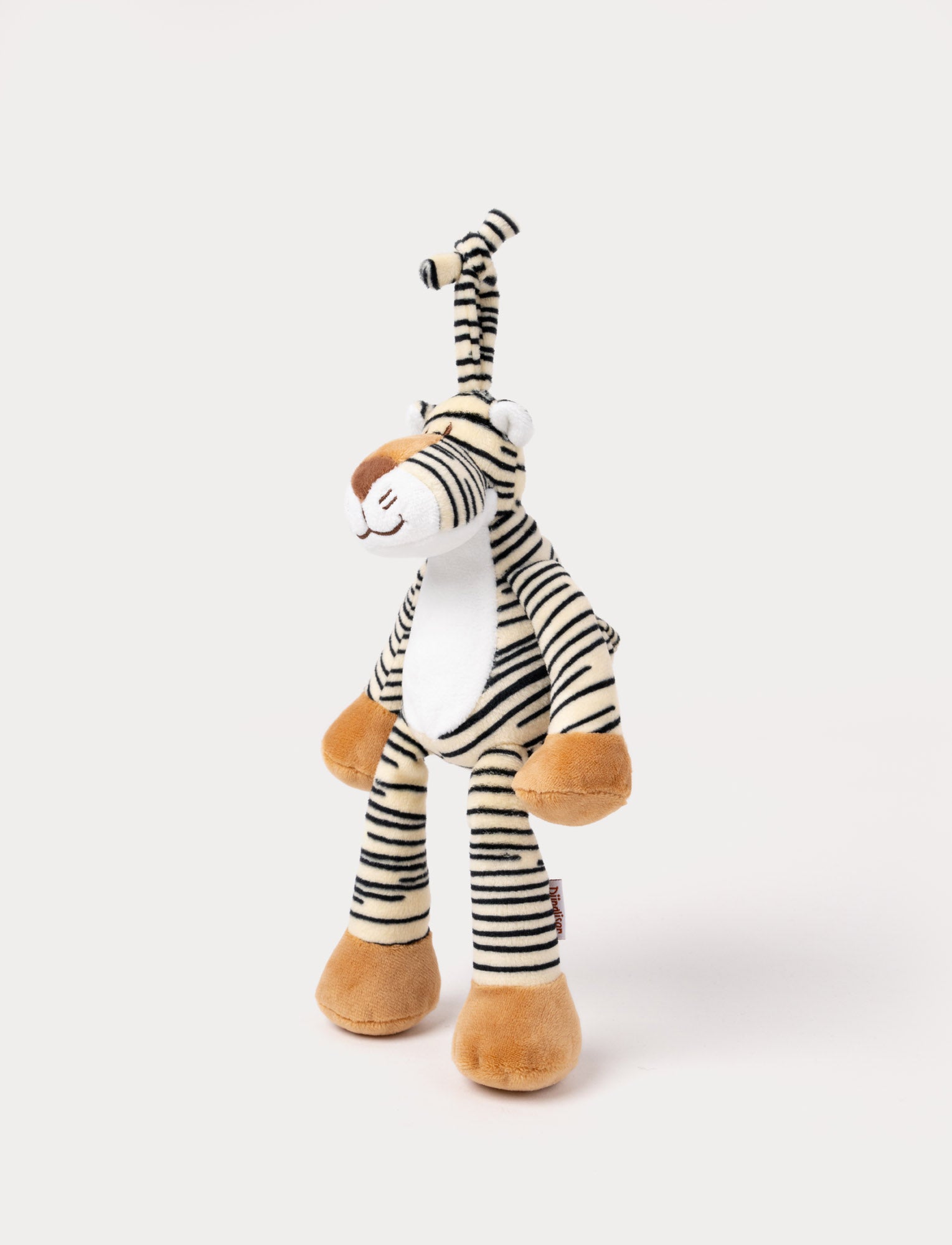 Image of A plush tiger music box with black stripes, a white belly, beige paws, and a fabric loop for hanging