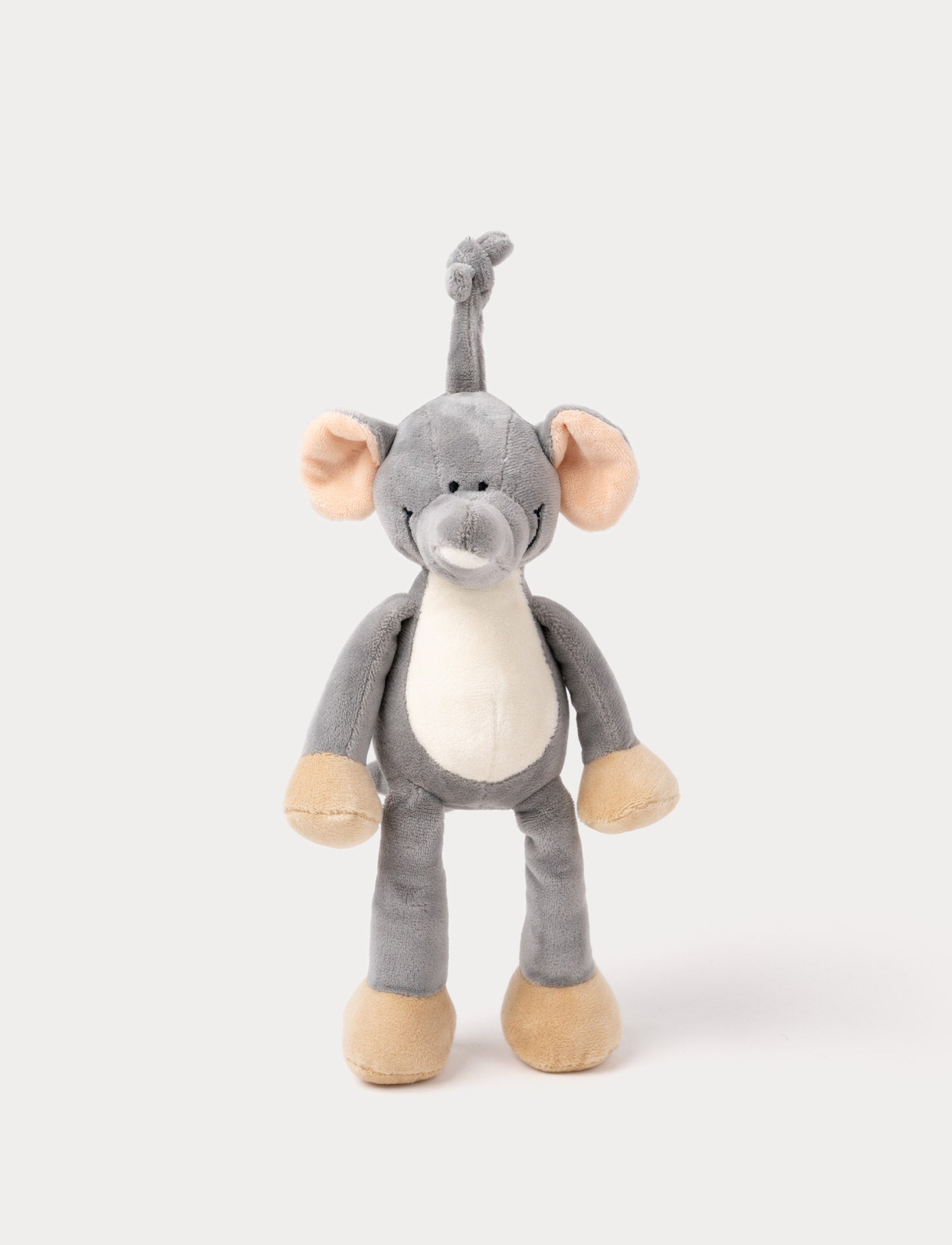 Image of A plush elephant music box with large ears, a white belly, beige feet, and a fabric loop for hanging.