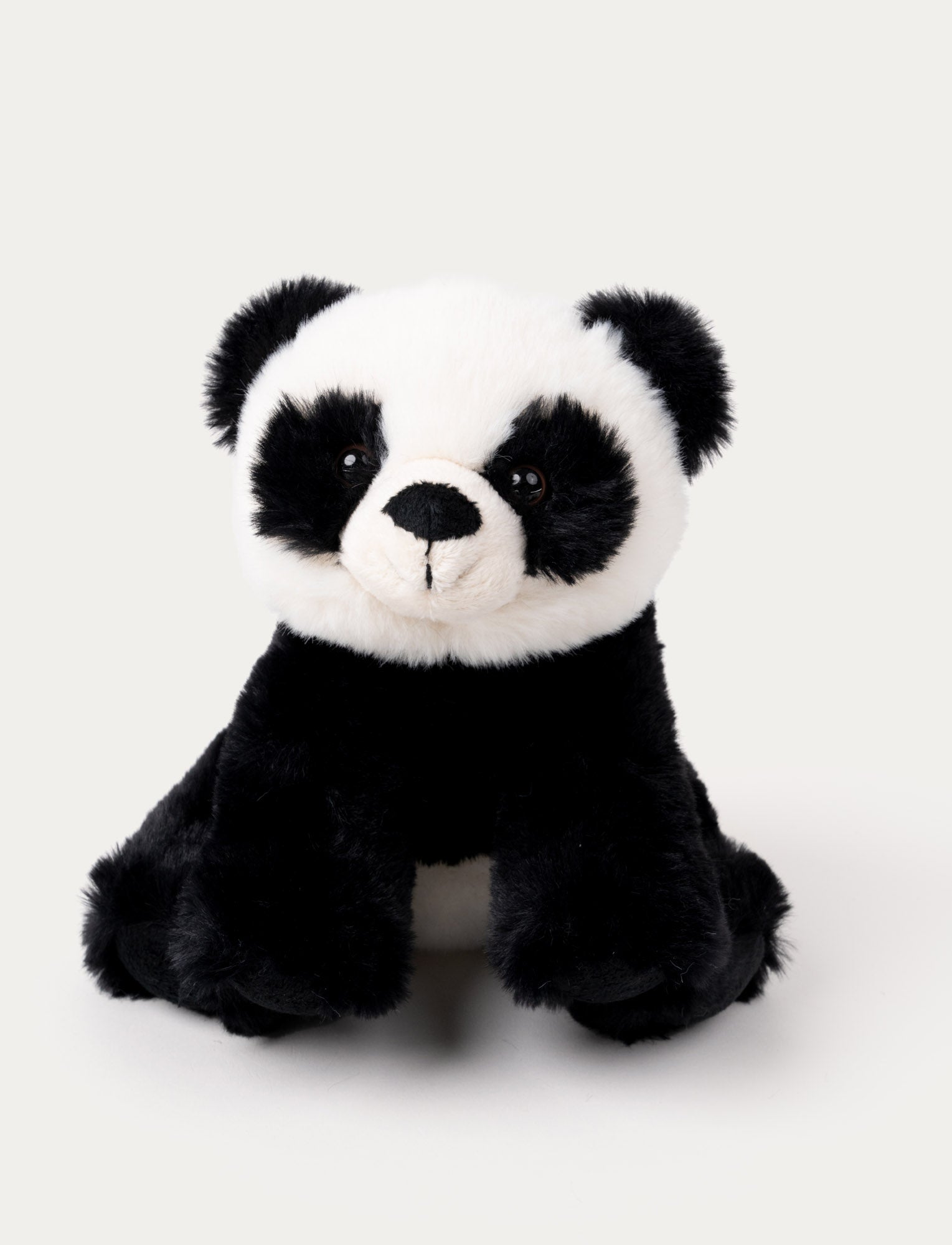 Image of A cuddly panda with soft black-and-white fur, an adorable nose, and lively plastic eyes.
