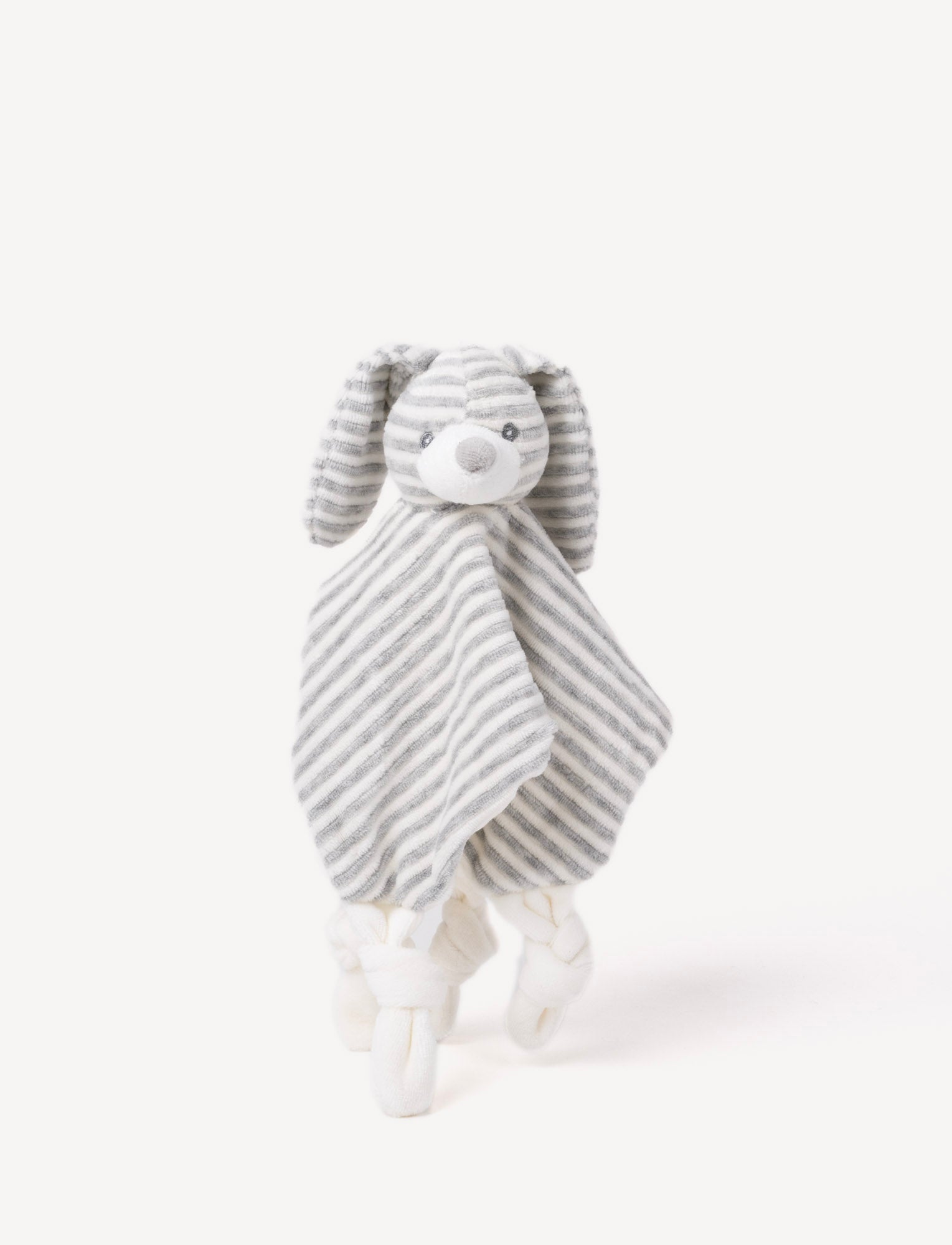 Image of A grey and white striped plush bunny comforter with floppy ears and knotted fabric ends.