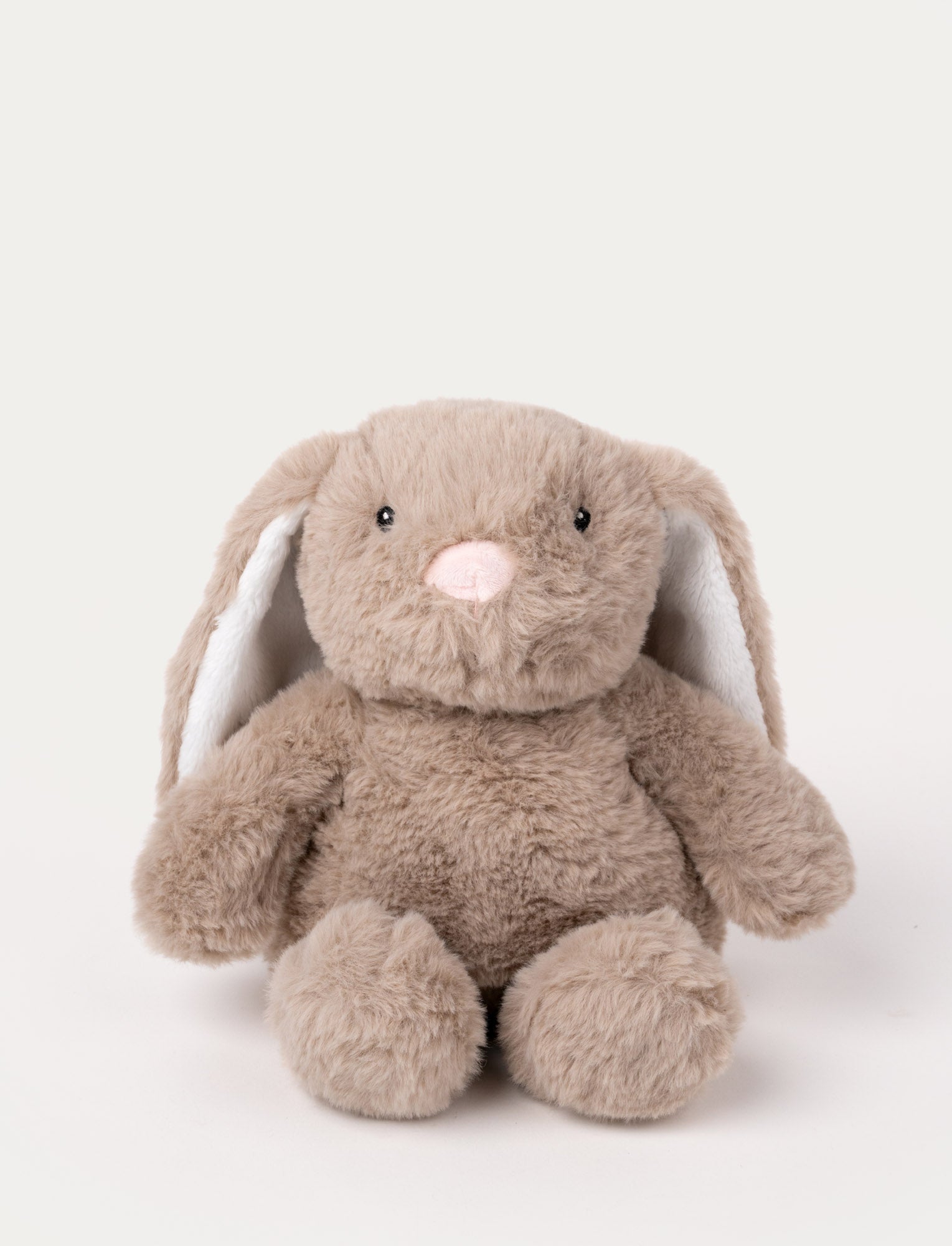 Image of Soft, light brown plush bunny with long floppy ears, black eyes, and a pink stitched nose.