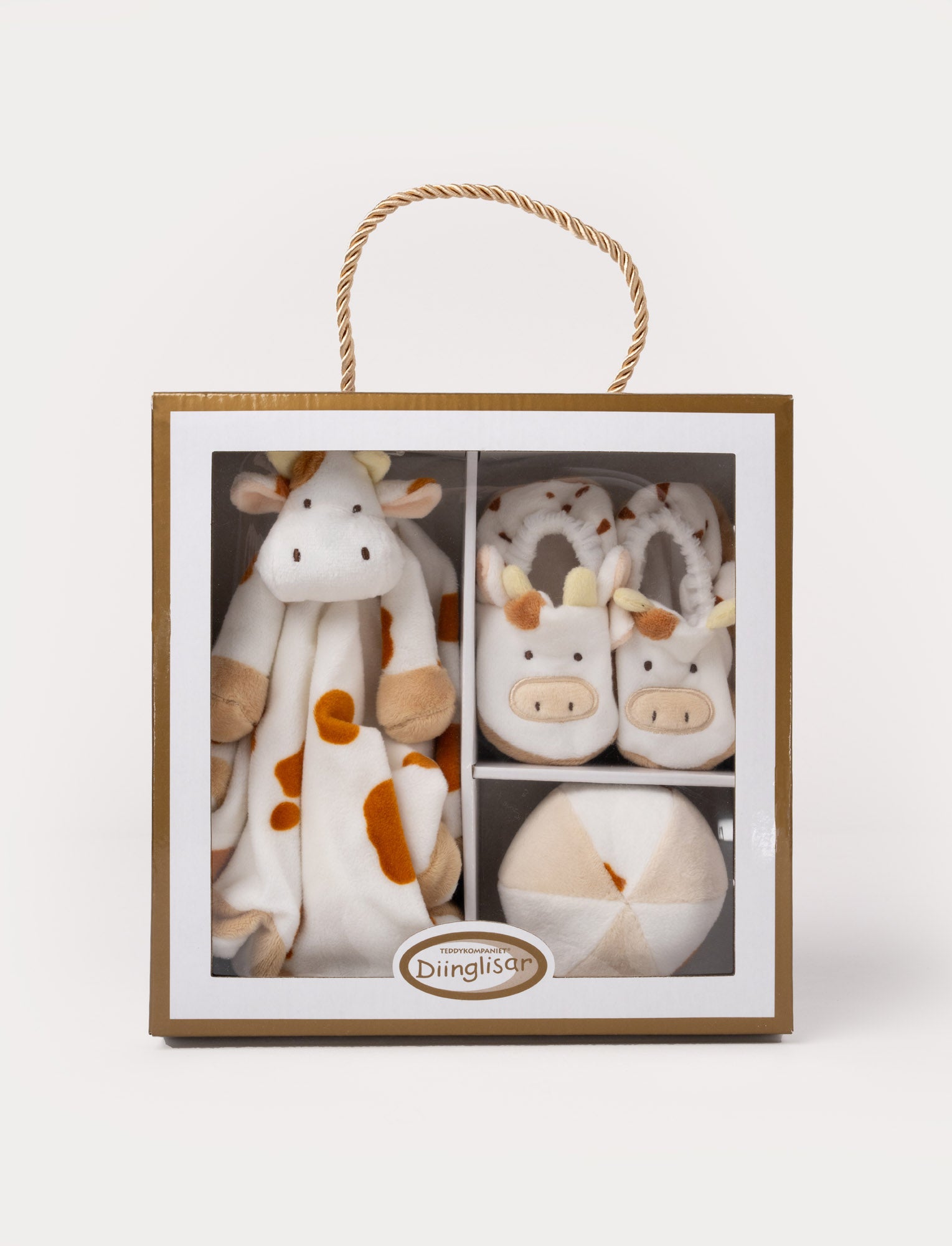 Image of A Diinglisar gift box set featuring a plush cow comforter, matching slippers, and a soft toy ball.