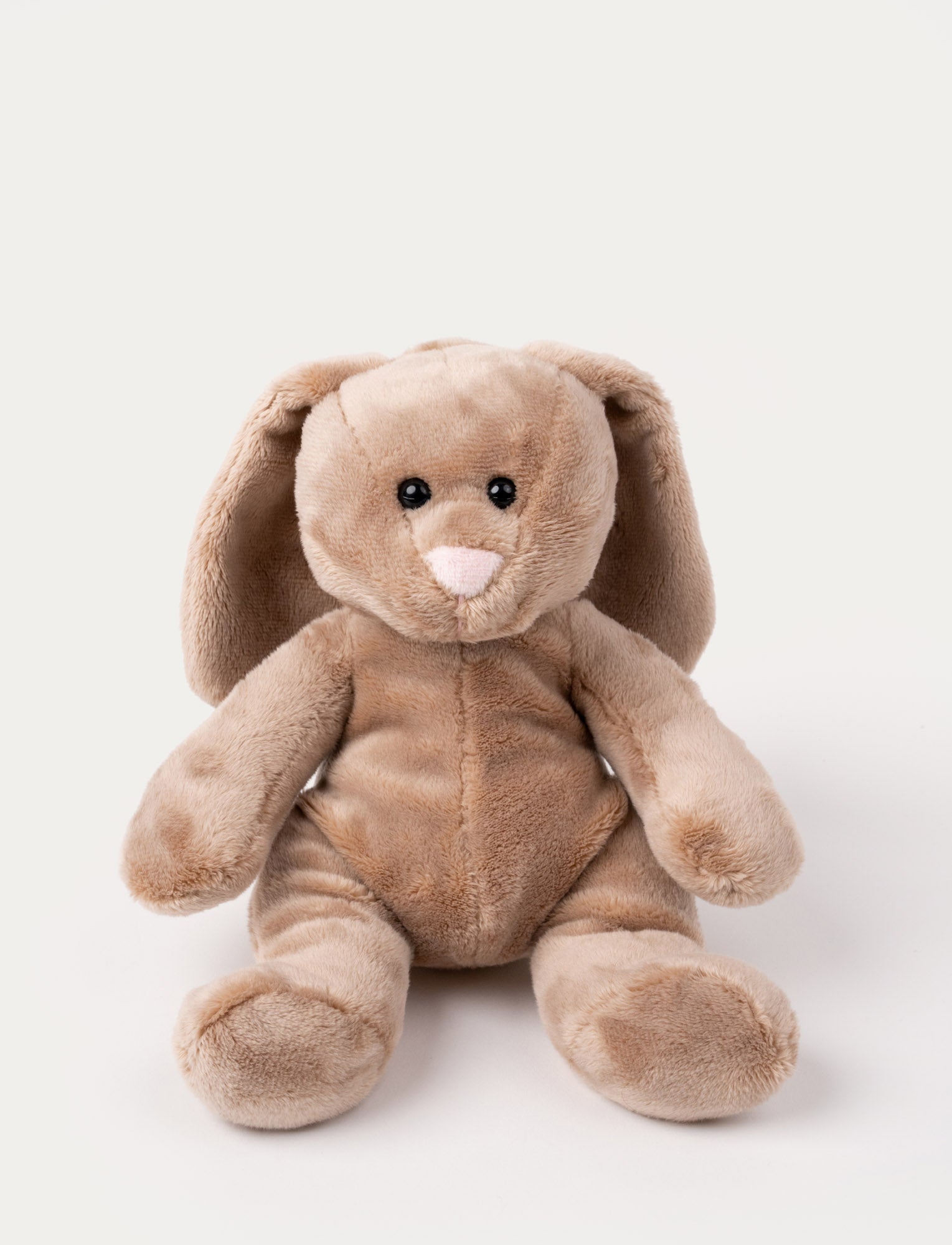 Image of Soft brown bunny plush with long floppy ears, a pink nose, and shiny black eyes.