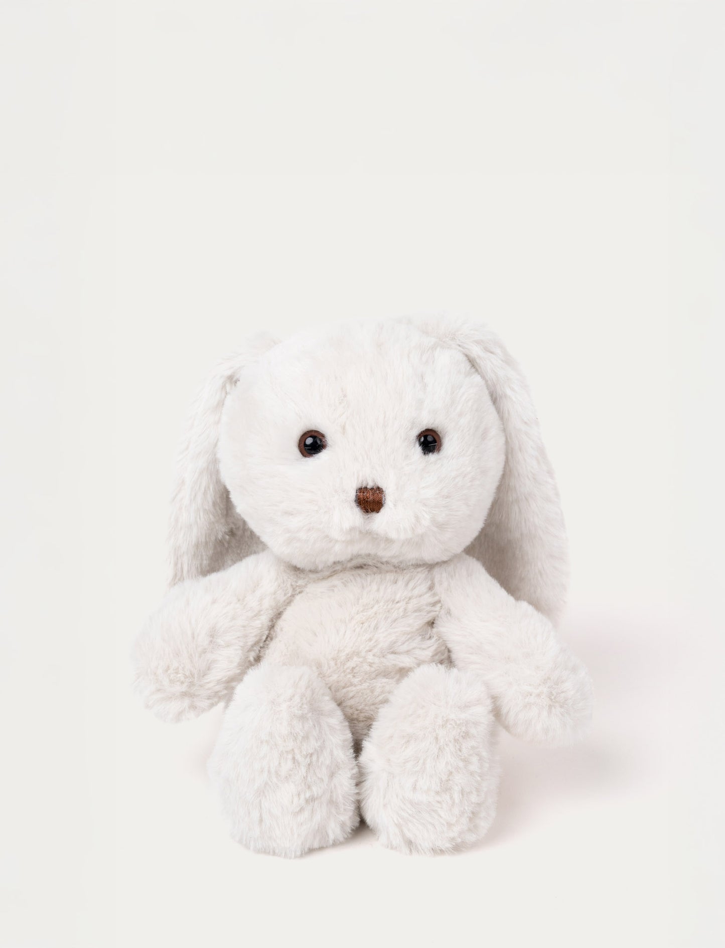 Soft white plush bunny with long floppy ears, brown eyes, and a stitched brown nose.