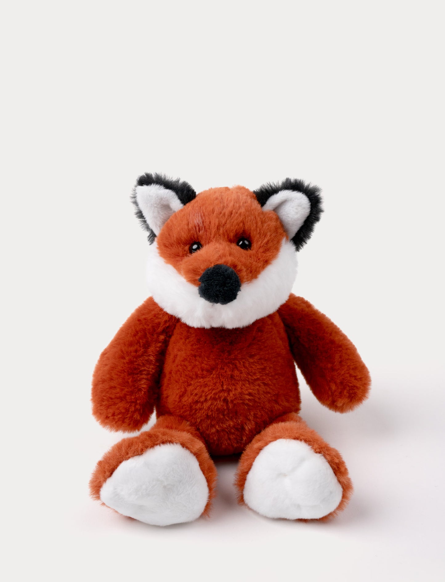 Soft red fox plush with a white belly, black-tipped ears, and shiny black eyes.