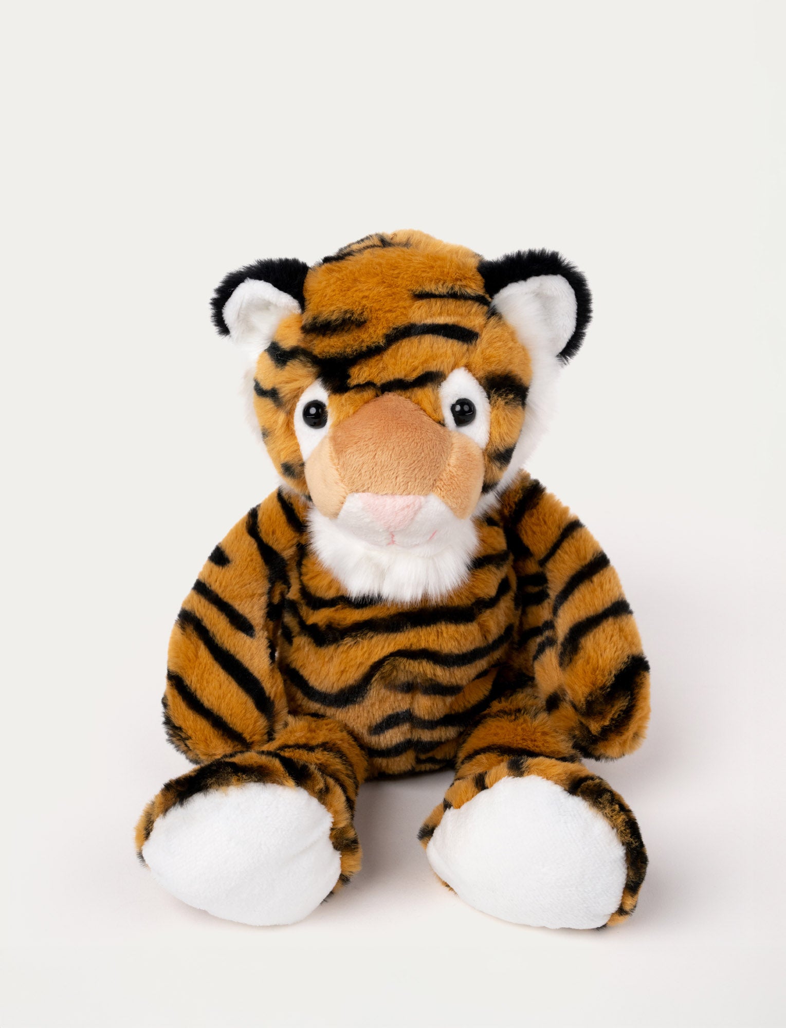 Image of Soft plush tiger with orange and black stripes, white accents, black-tipped ears, and a stitched pink nose.