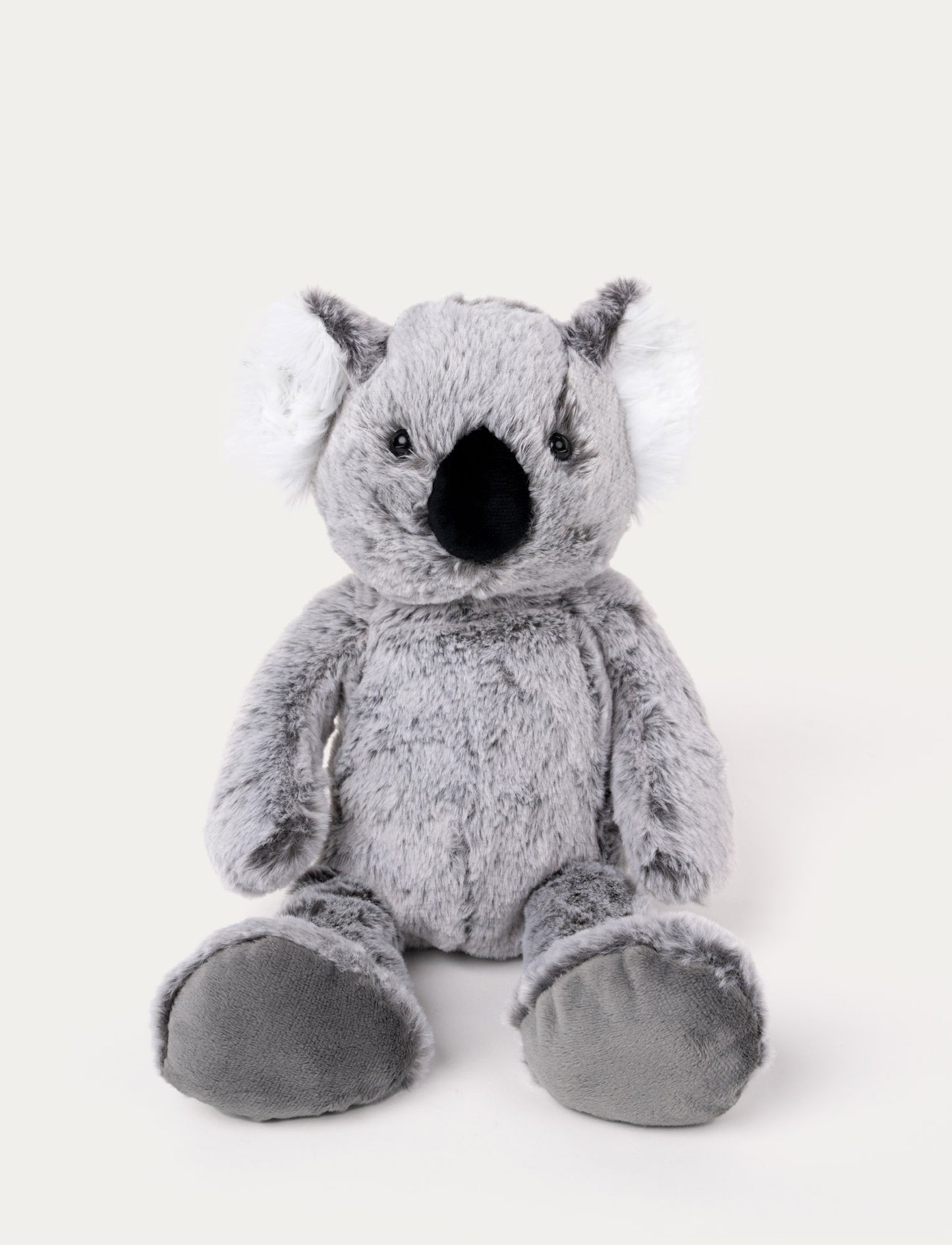 Soft, plush koala with grey fur, fluffy white ears, a black nose, and large padded feet, sitting upright.