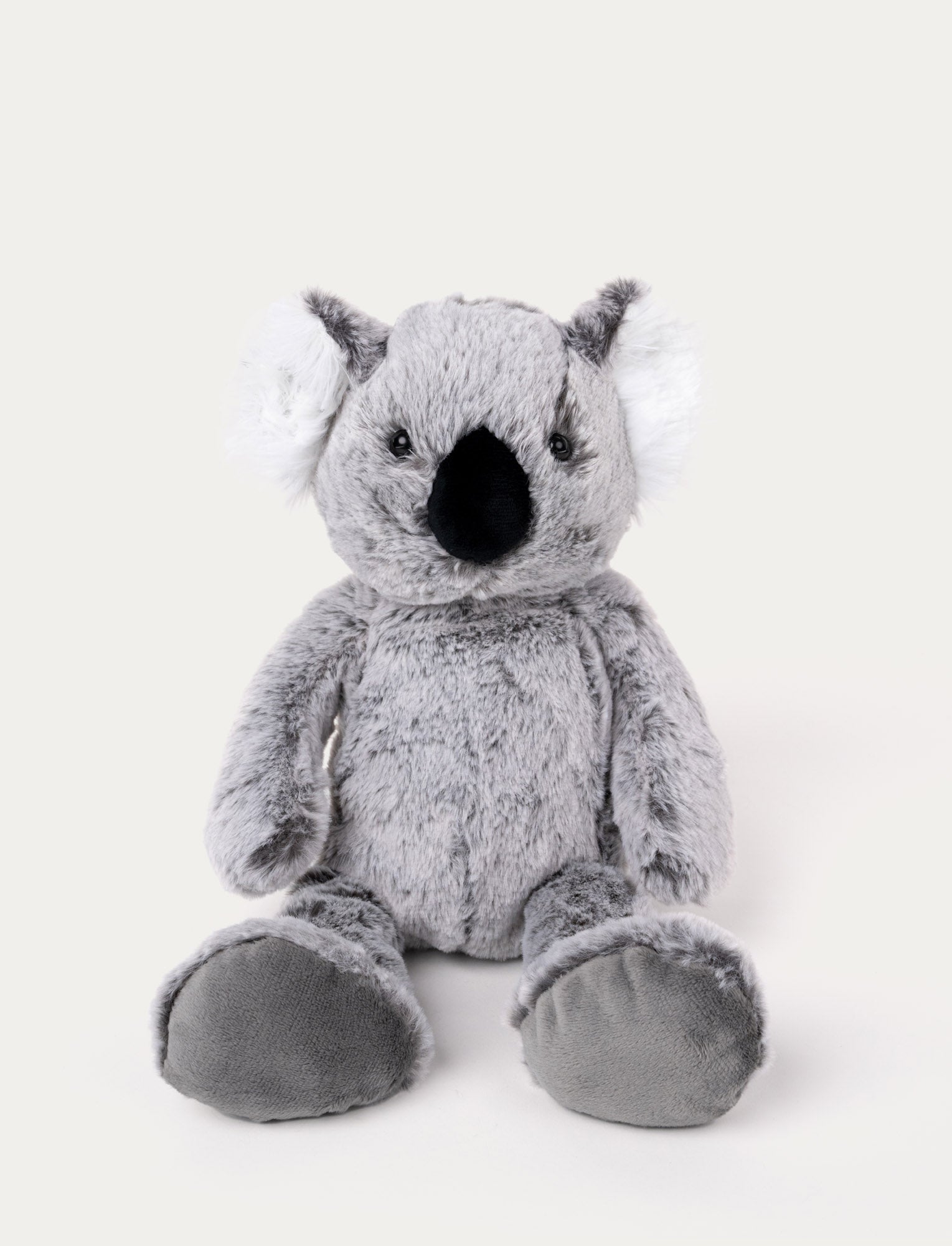Image of Soft, plush koala with grey fur, fluffy white ears, a black nose, and large padded feet, sitting upright.