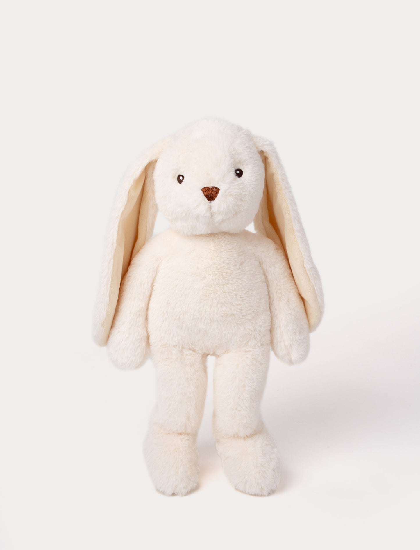 Soft, plush bunny with cream-colored fur, long floppy ears, black button eyes, and a small stitched nose.