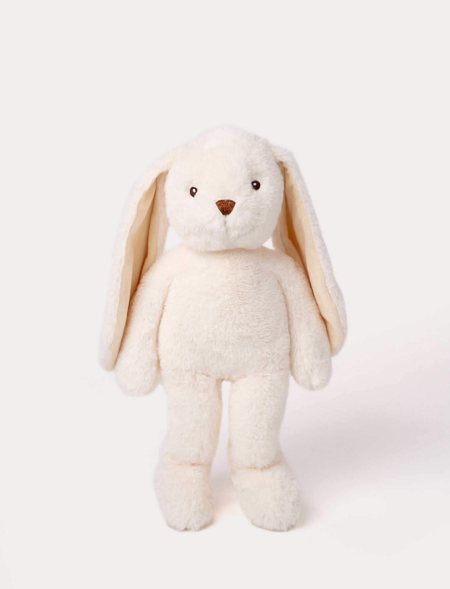 Image of Soft, plush bunny with cream-colored fur, long floppy ears, black button eyes, and a small stitched nose.