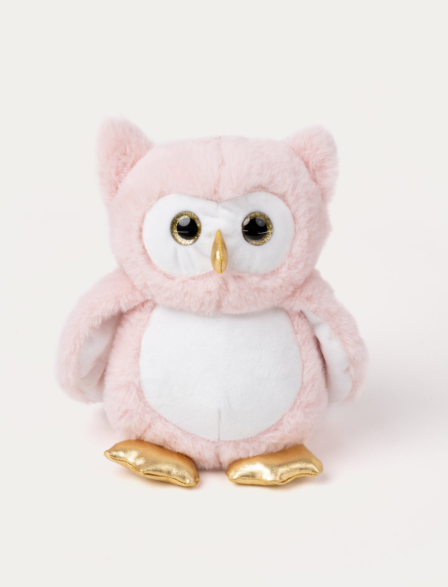 Soft pink owl plush with a white belly and face that glow in the dark, gold beak and feet, and shiny black eyes.