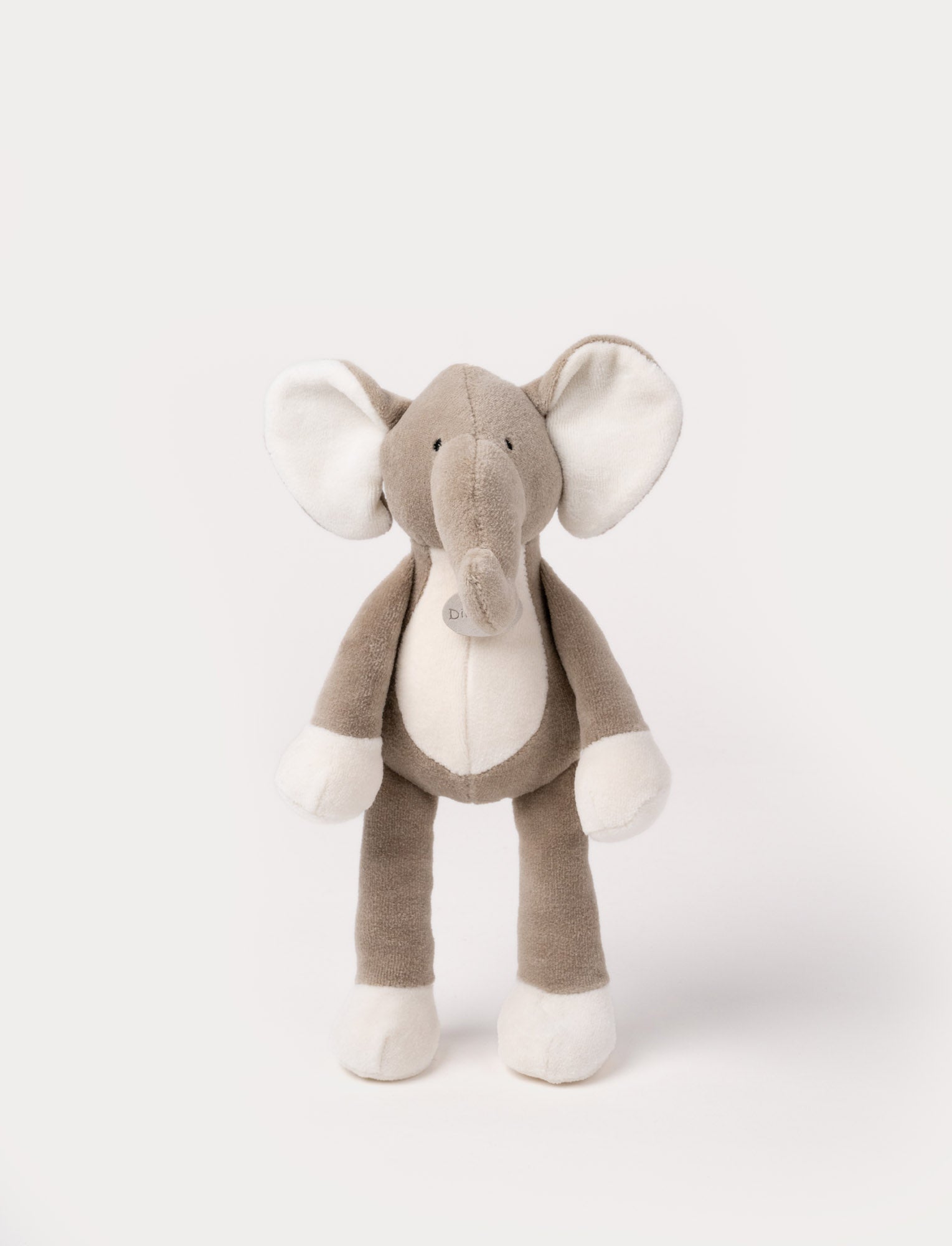 Image of A soft plush brown elephant, with broaded eyes, white belly, ears and paws.