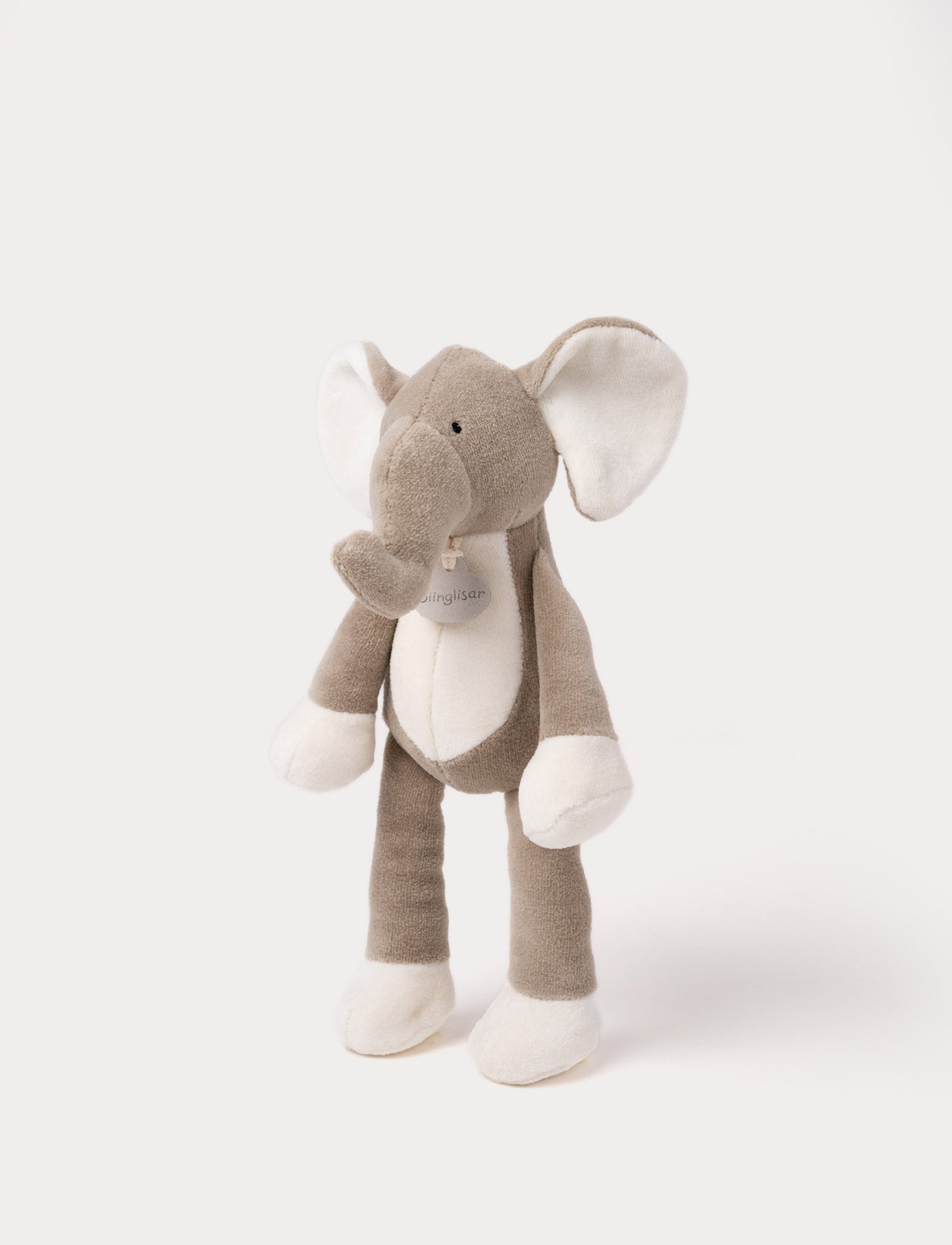 Image of A soft plush beige bunny  with broaded eyes and nose, white, and brown details.