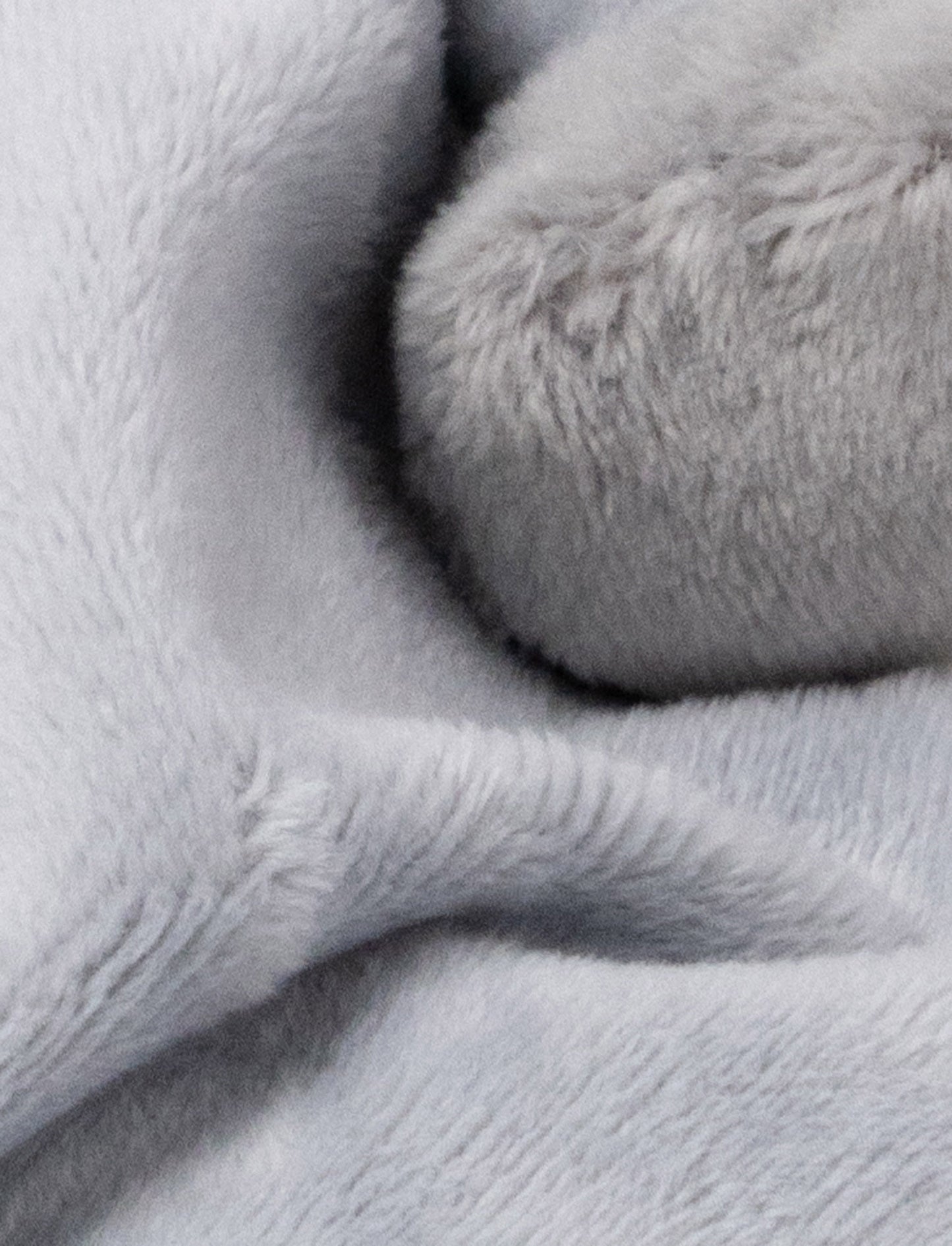 Soft baby blanket with a plush gray llama head, white face, and white-trimmed edges.