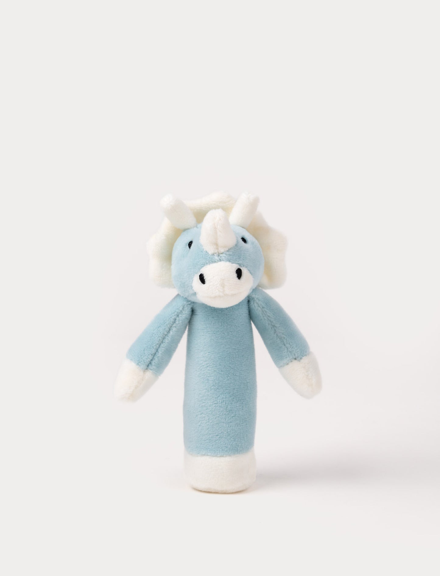 Soft plush triceratops rattle with a blue body, white horns, a frilled crest, and embroidered eyes.