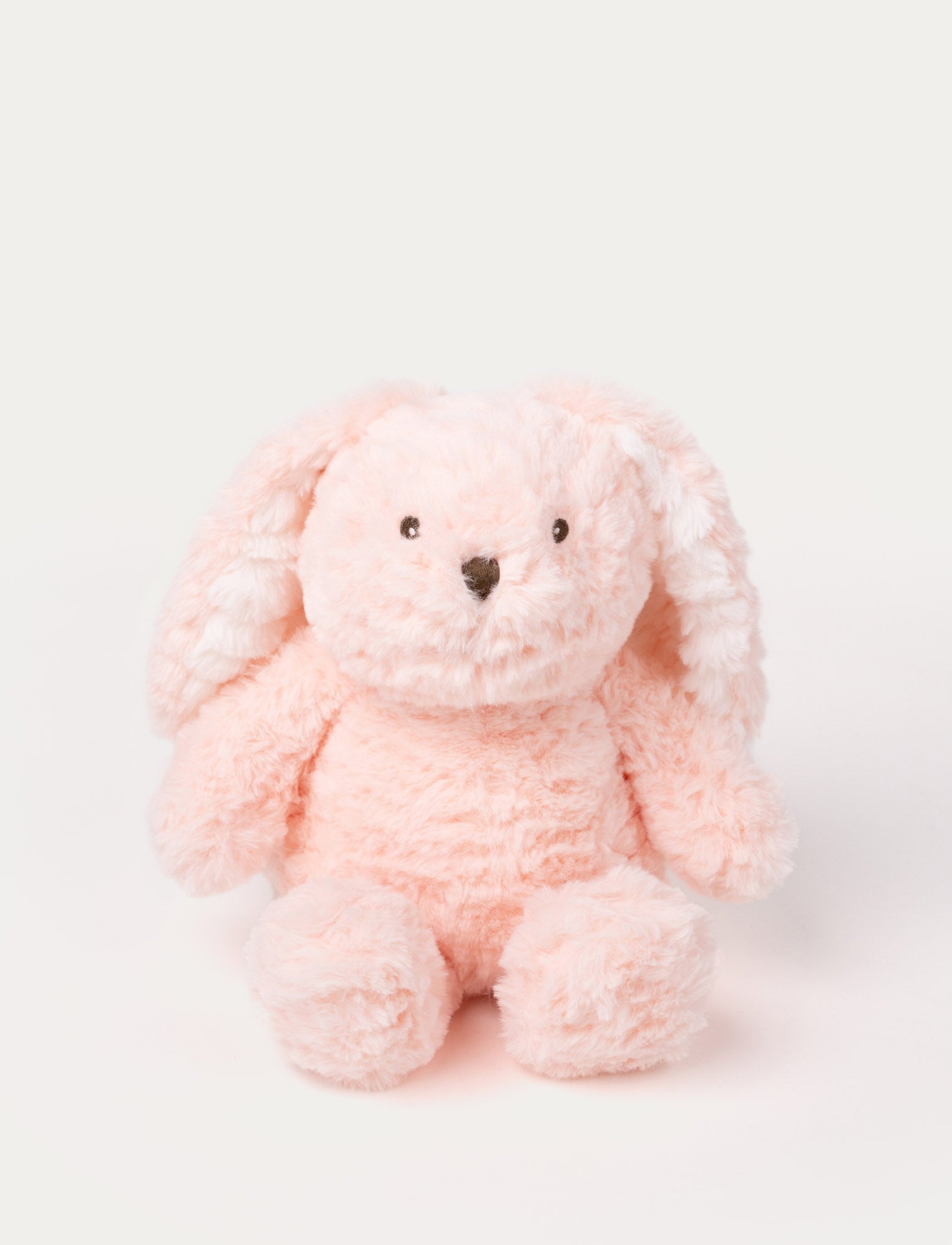 Image of Soft pink bunny plush with floppy ears, fluffy fur, and a stitched nose.
