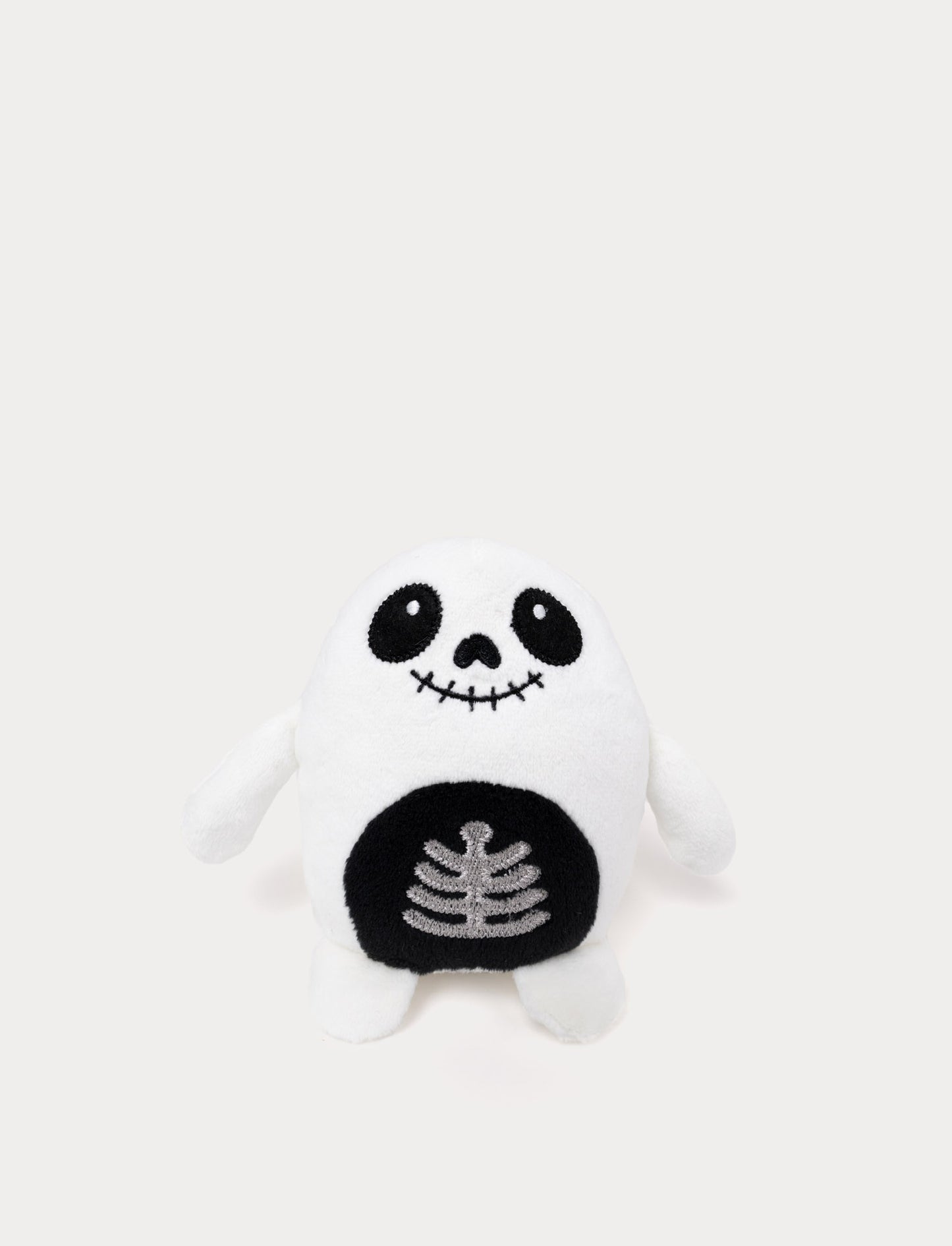 Soft white ghost plush toy with glow-in-the-dark effect. Skeleton design.