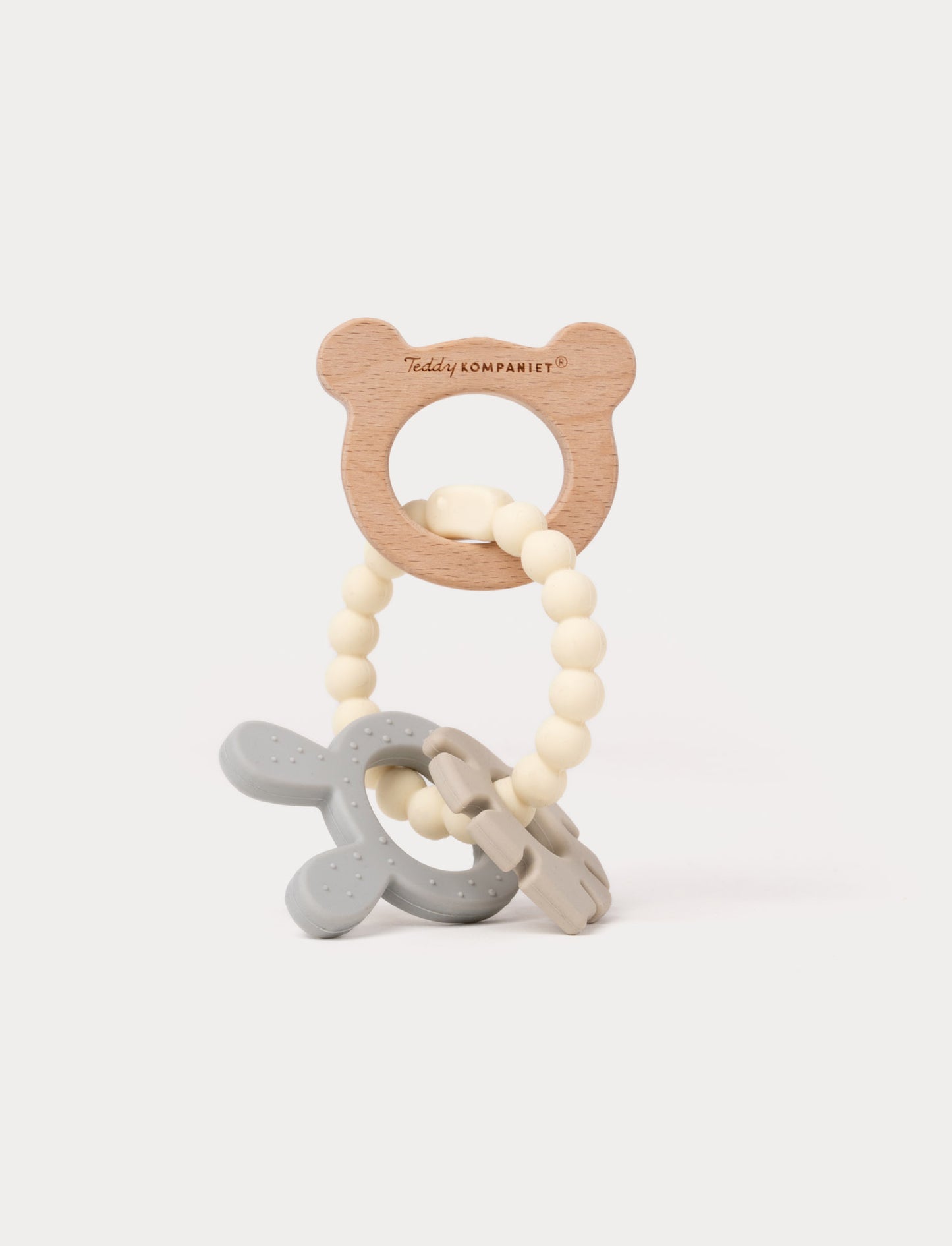 Wooden and silicone baby teething toy with a bear-shaped handle, beaded loop, and soft textured shapes.