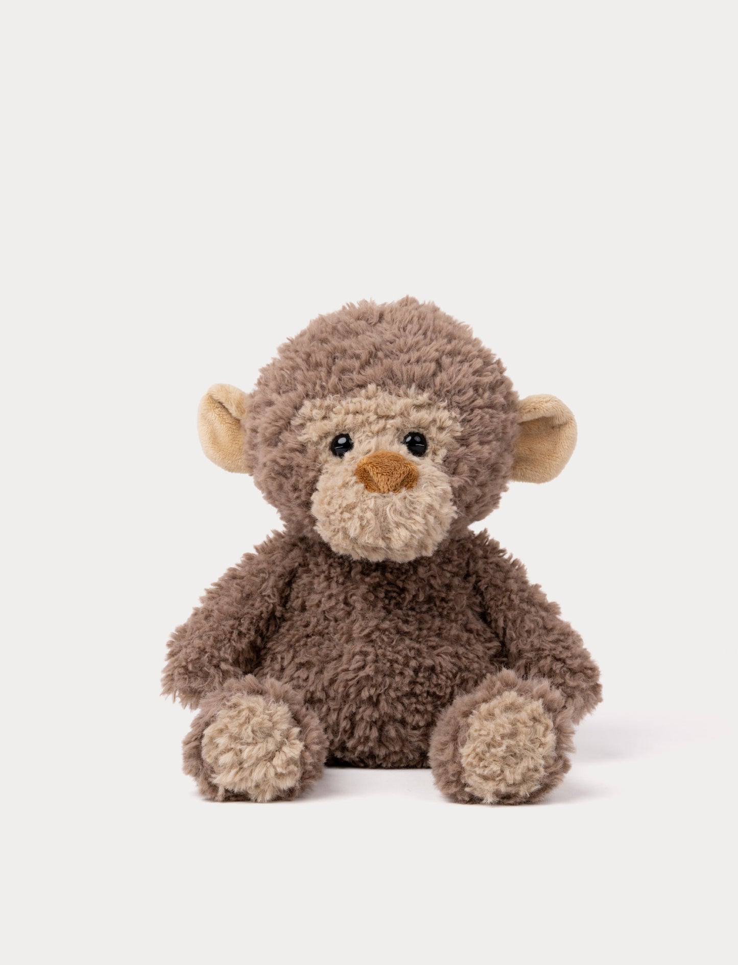 Soft brown monkey plush toy with curly fur, beige face, and cute round ears.