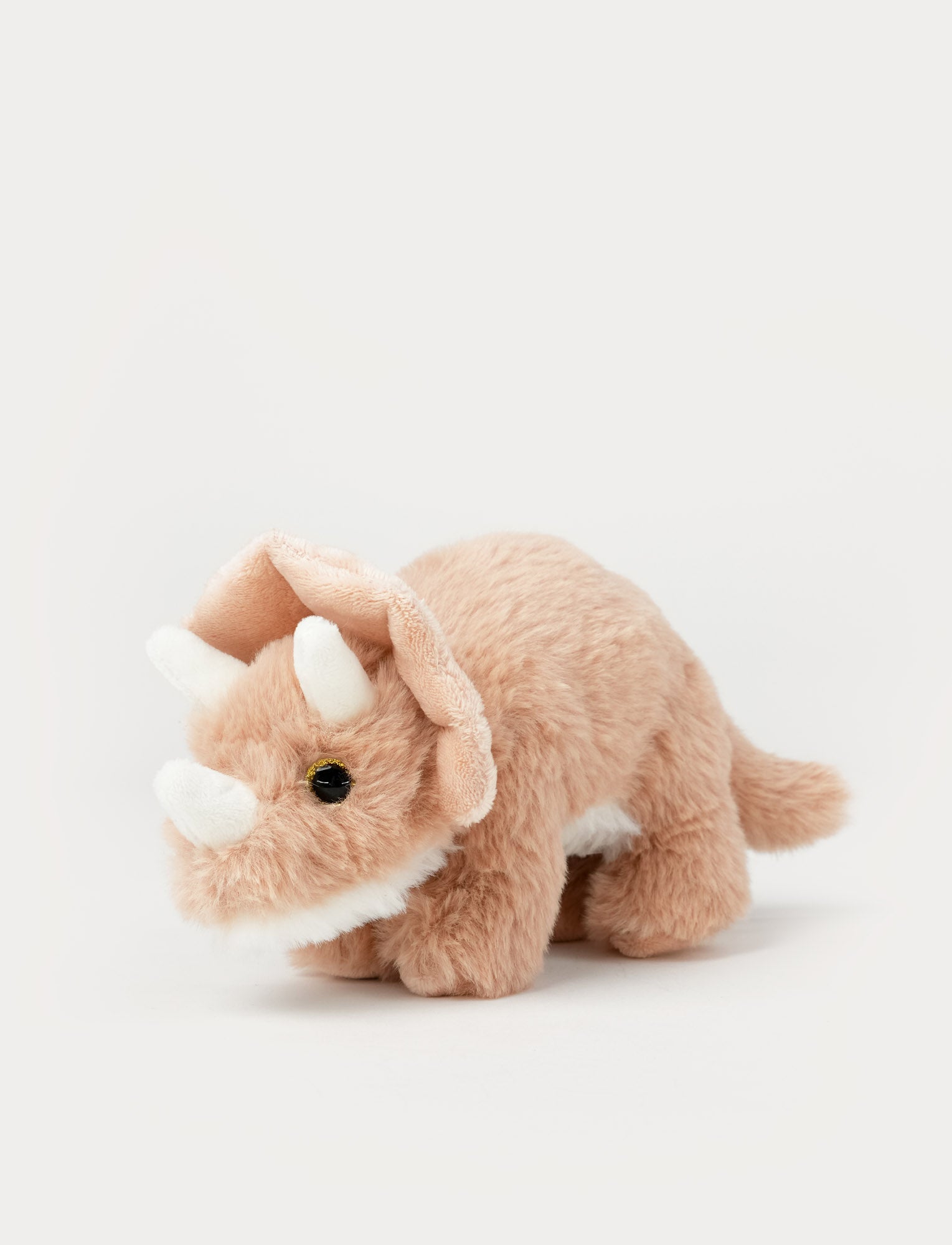 Image of Soft peach Triceratops dinosaur plush toy with fluffy fur and three white horns