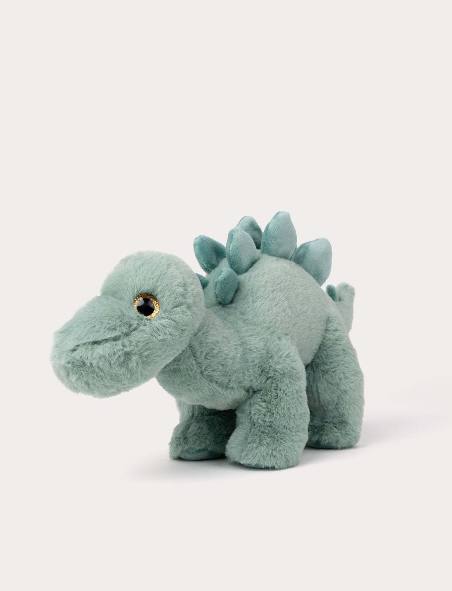 Image of Soft green Stegosaurus dinosaur plush toy with fluffy fur and back plates
