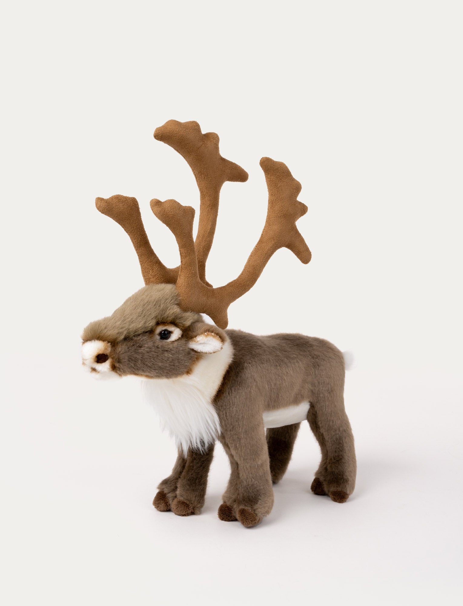 Image of Soft reindeer plush with brown fur, large detailed antlers, a fluffy mane, and shiny black eyes.