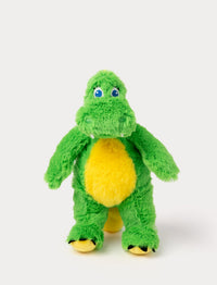 A plush green dinosaur with a round yellow belly, blue embroidered eyes, and small white teeth. It has a soft, fuzzy texture and a friendly expression.