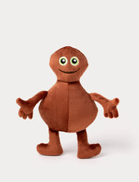 Brown plush toy with a round body, long arms, big green eyes, and a friendly embroidered smile.