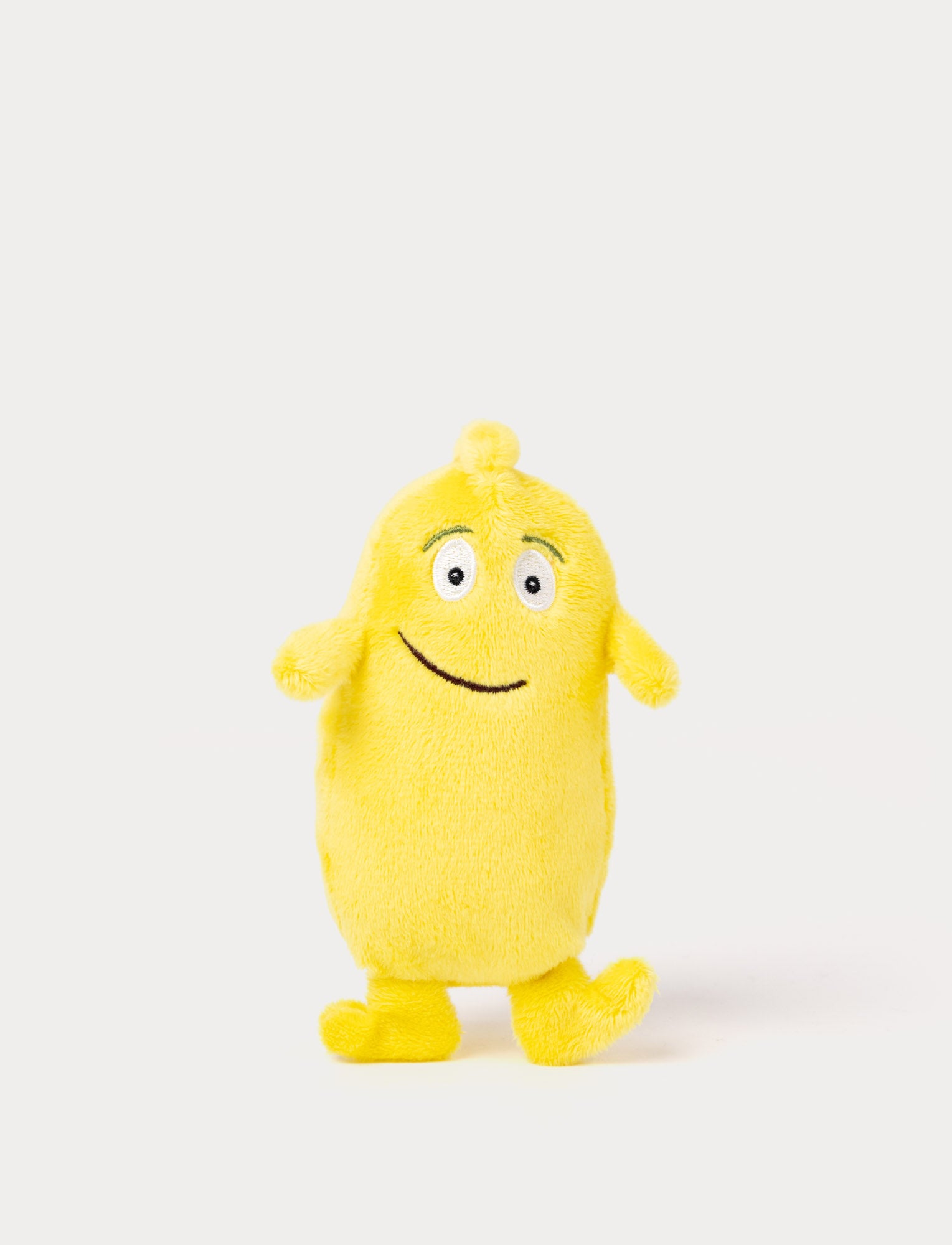  Image of A yellow plush Bibbi with a friendly smile and very small and oblong deisgn  
