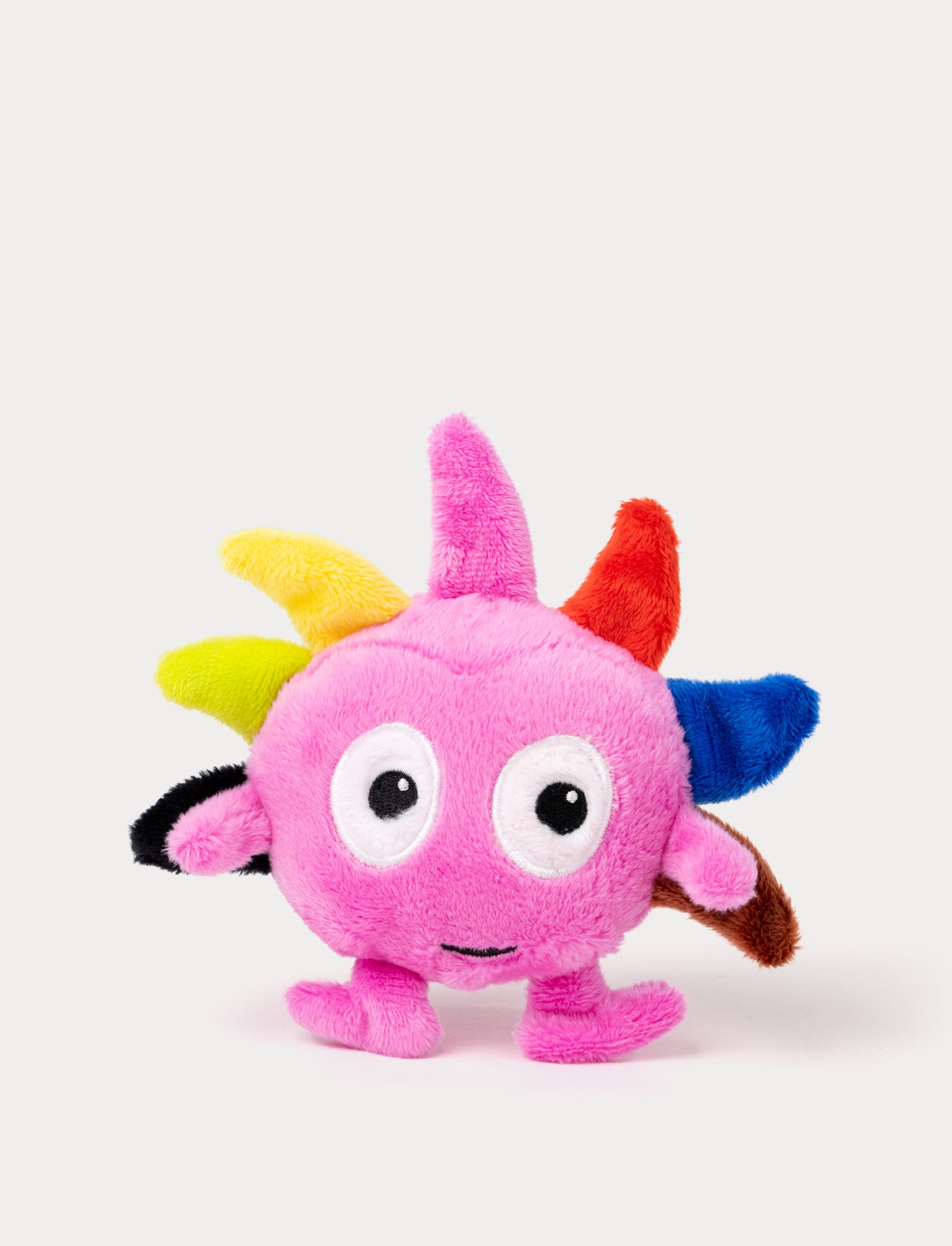  Image of A green plush Dadda with colorful spikes on top of the head and a very small deisgn  