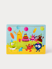 Colorful wooden puzzle depicting Babblarna characters at a festive birthday party with balloons, cake, and party hats.