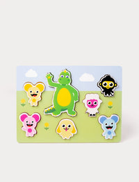 A wooden puzzle featuring the Bolibompa dragon and colorful animal characters on a grassy background.
