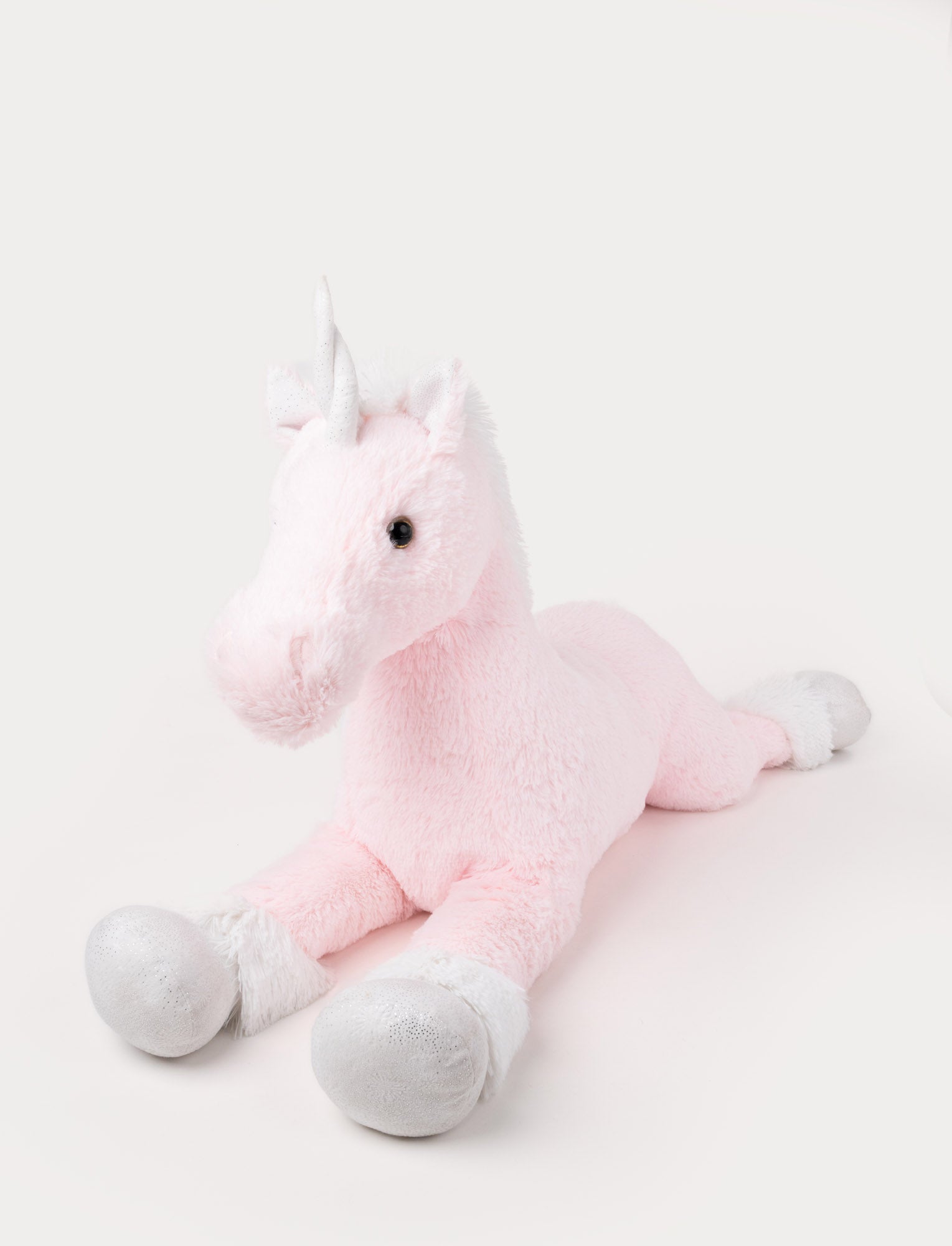  Image of Soft pink plush unicorn with silver hooves, a white mane, and a shimmering silver horn.
