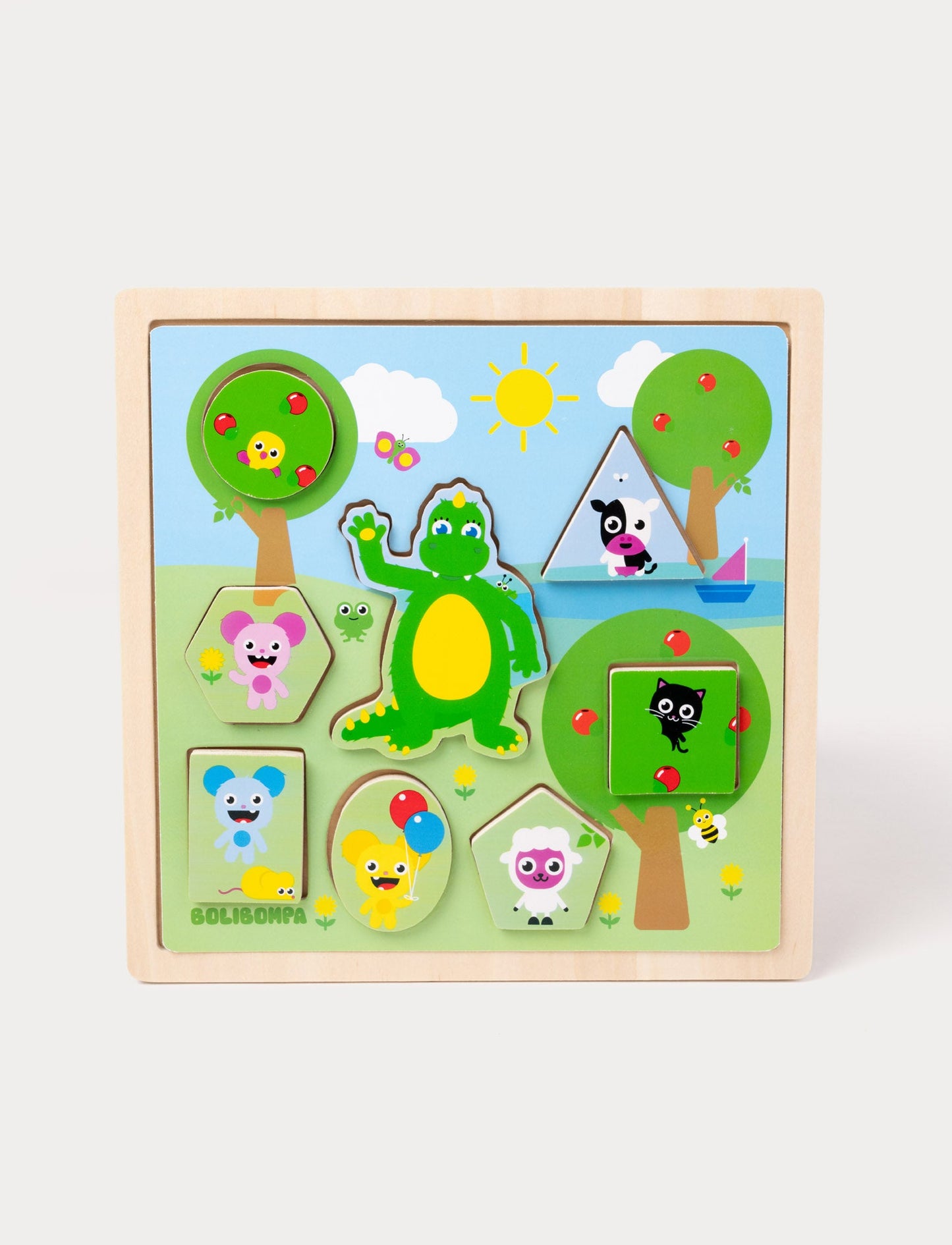 A wooden Bolibompa puzzle featuring the green dragon and colorful animal characters in a sunny landscape.