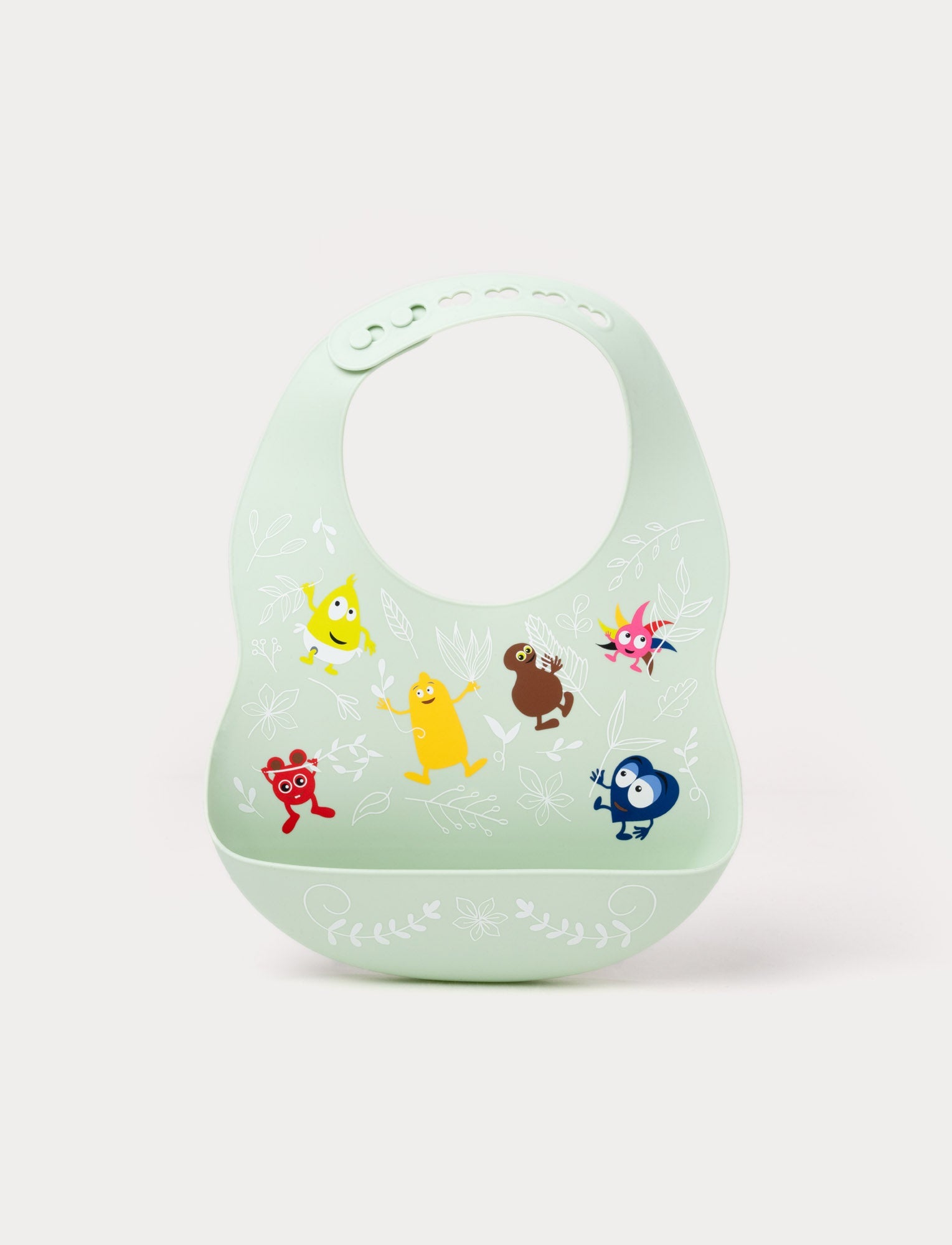  Image of A soft green silicone baby bib with Babblarna characters and a leaf pattern, featuring a built-in food catcher.