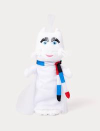A plush toy of a white cat wearing a flowing cape and a striped red, blue, black, and white scarf.